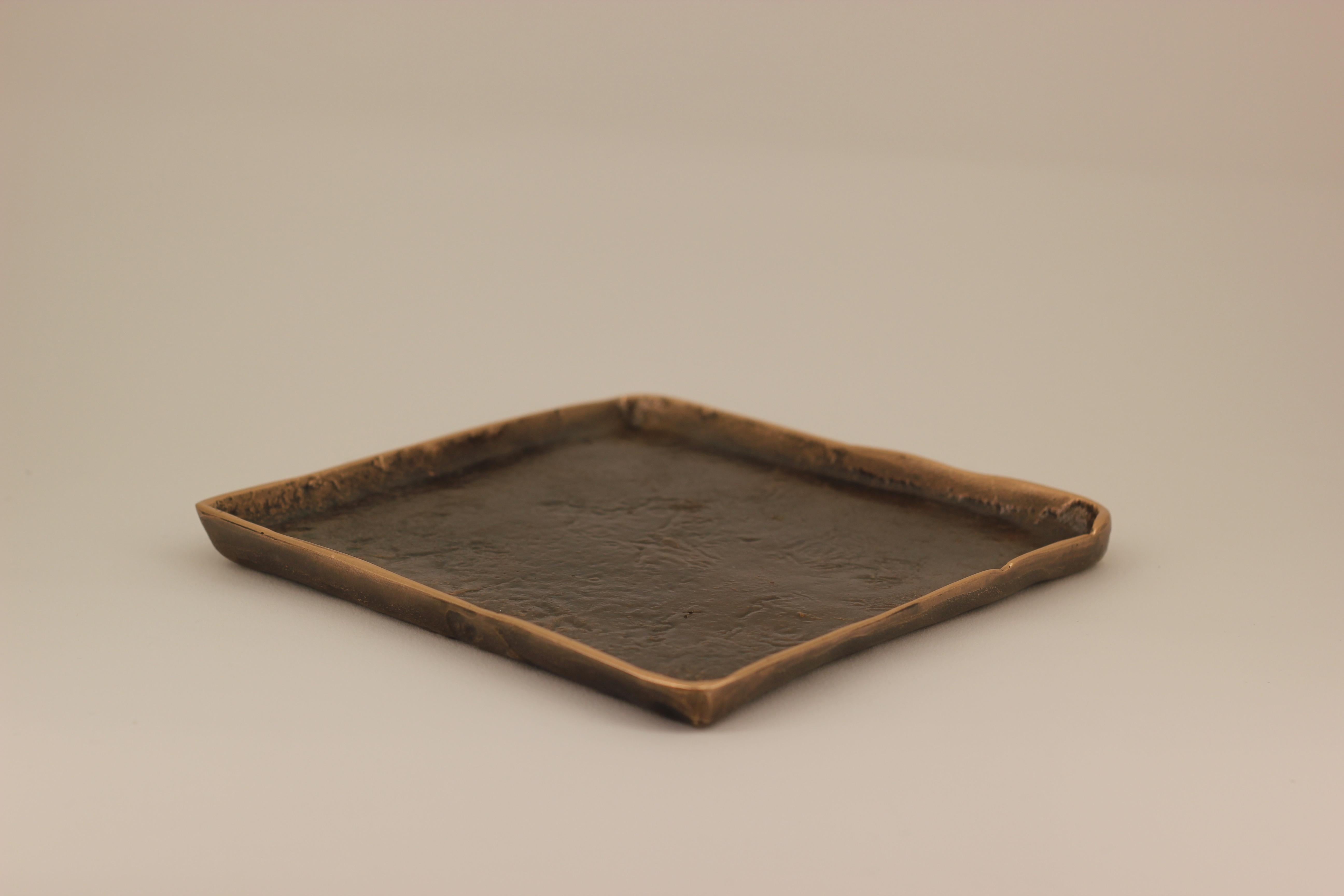 Graceful bronze tray, vide-poche, inspired by Wabi-Sabi, the ancient Japanese philosophy that views and embraces the world for its imperfections and transient nature. It translates into an exquisite aesthetic that is imperfect and incomplete, yet