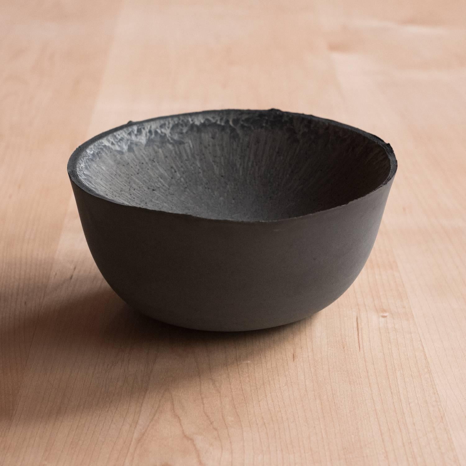 A collection of 236 unique bowls, the Concrete series by UMÉ Studio expresses the tension between heavy concrete and its delicate edge generated by hand pouring. While one assumes concrete should be strong and durable, it is, at its core, fragile.