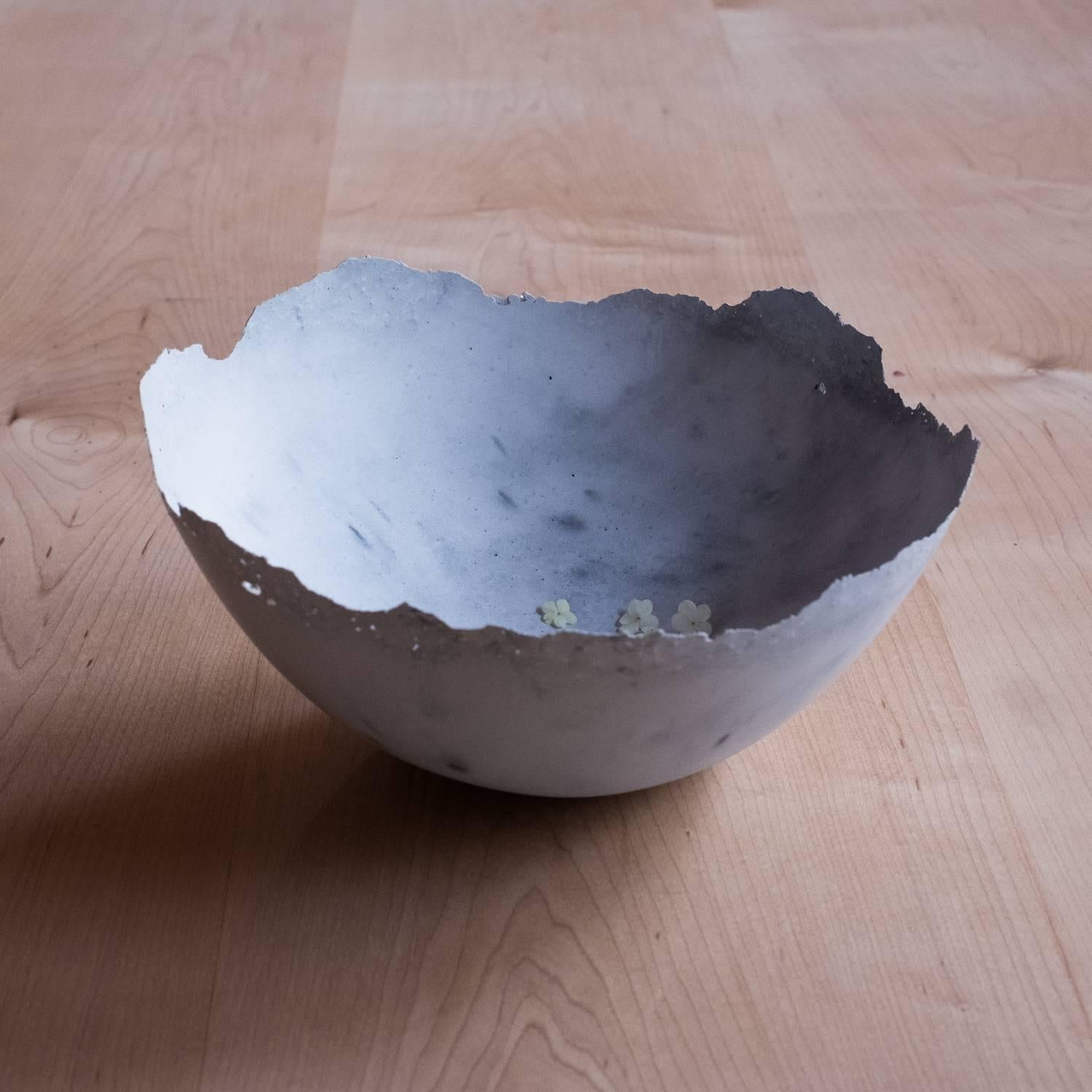 A collection of 236 unique bowls, the Concrete Series by UMÉ Studio expresses the tension between heavy concrete and its delicate edge generated by hand pouring. While one assumes concrete should be strong and durable, it is, at its core, fragile.