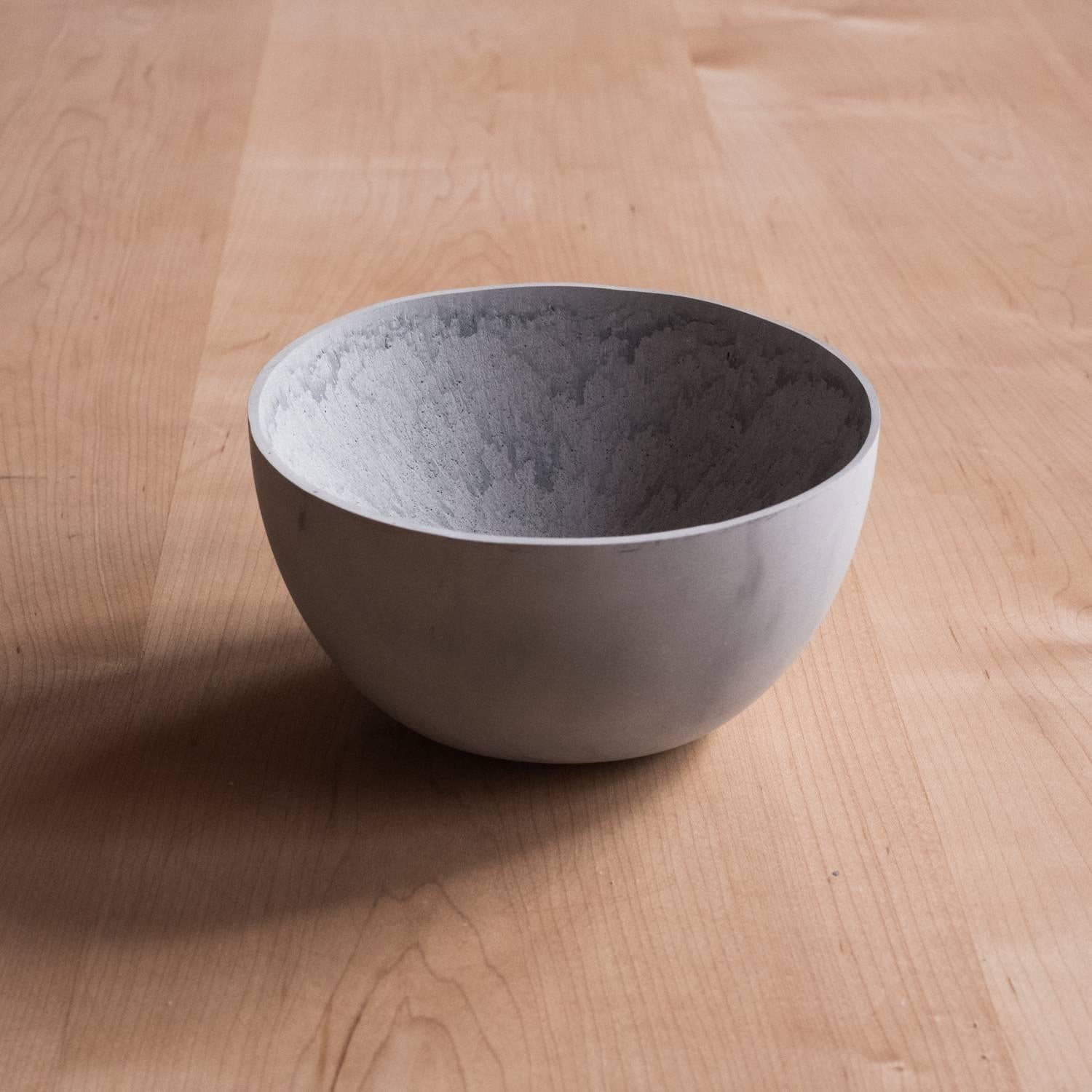 A collection of 236 unique bowls, the Concrete Series by UMÉ Studio expresses the tension between heavy concrete and its delicate edge generated by hand pouring. While one assumes concrete should be strong and durable, it is, at its core, fragile.