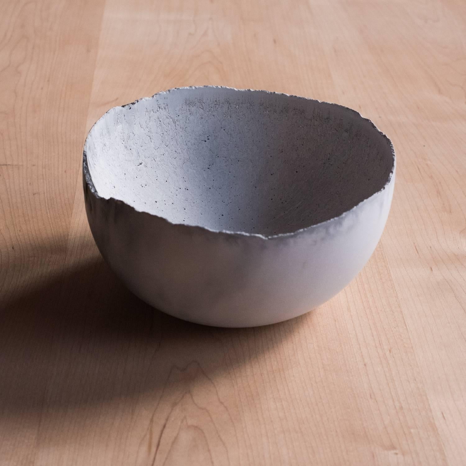 A collection of 236 unique bowls, the Concrete Series by UMÉ Studio expresses the tension between heavy concrete and its delicate edge generated by hand pouring. While one assumes concrete should be strong and durable, it is, at its core, fragile.