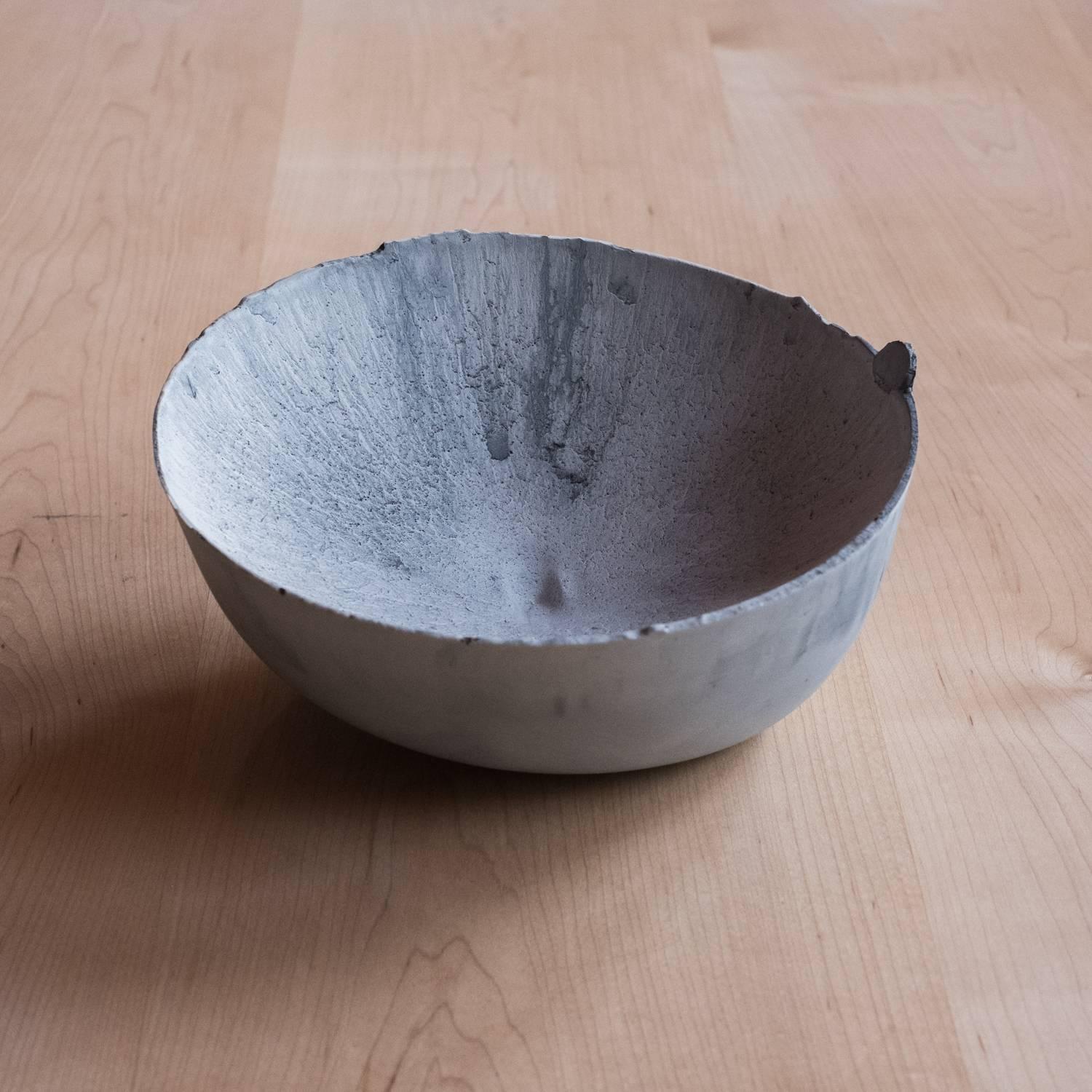 A collection of 236 unique bowls, the Concrete Series by UMÉ Studio expresses the tension between heavy concrete and its delicate edge generated by hand pouring. While one assumes concrete should be strong and durable, it is, at its core, fragile.