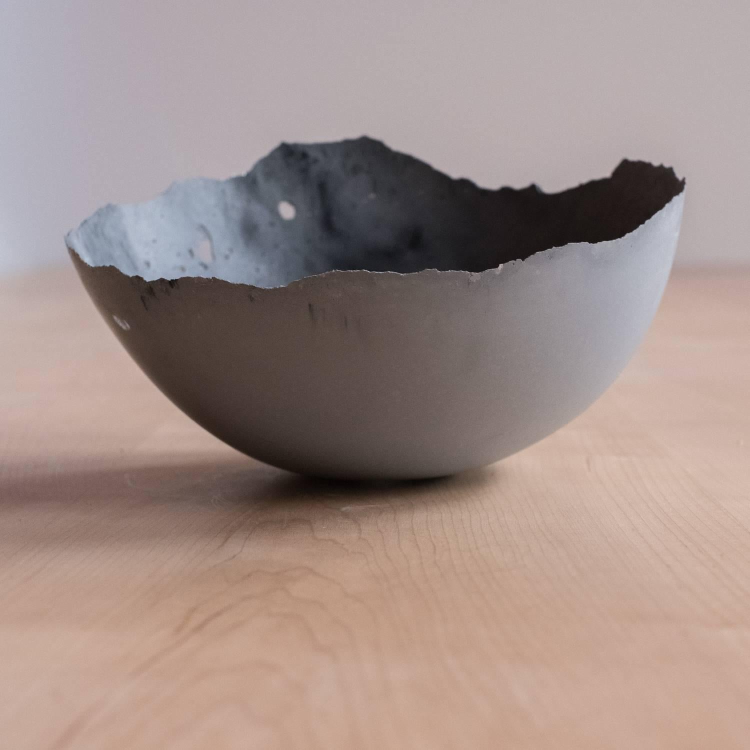 A collection of 236 unique bowls, the Concrete Series by UMÉ Studio expresses the tension between heavy concrete and its delicate edge generated by hand pouring. While one assumes concrete should be strong and durable, it is, at its core, fragile.