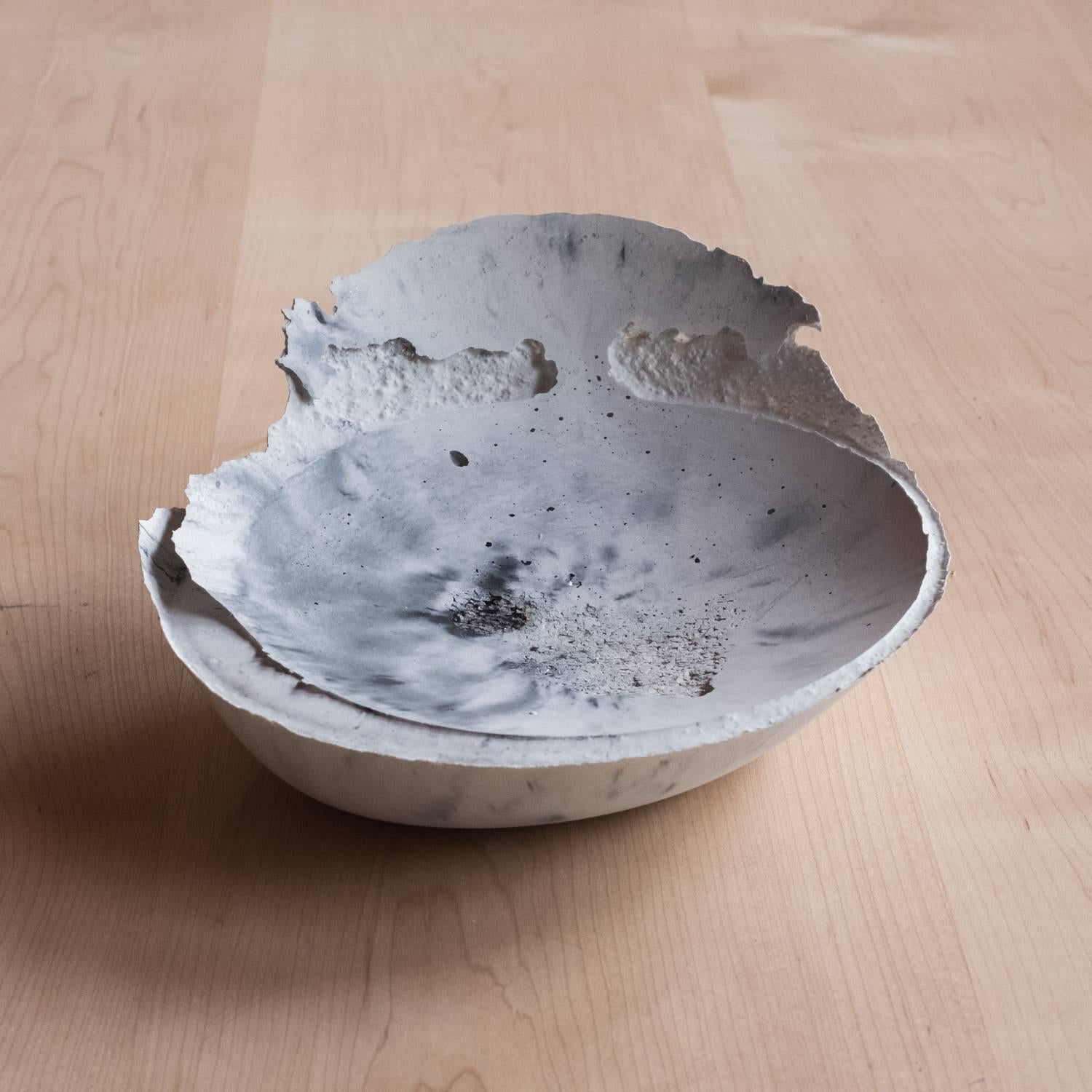 A collection of 236 unique bowls, the concrete series by UMÉ studio expresses the tension between heavy concrete and its delicate edge generated by hand pouring. While one assumes concrete should be strong and durable it is at its core, fragile.