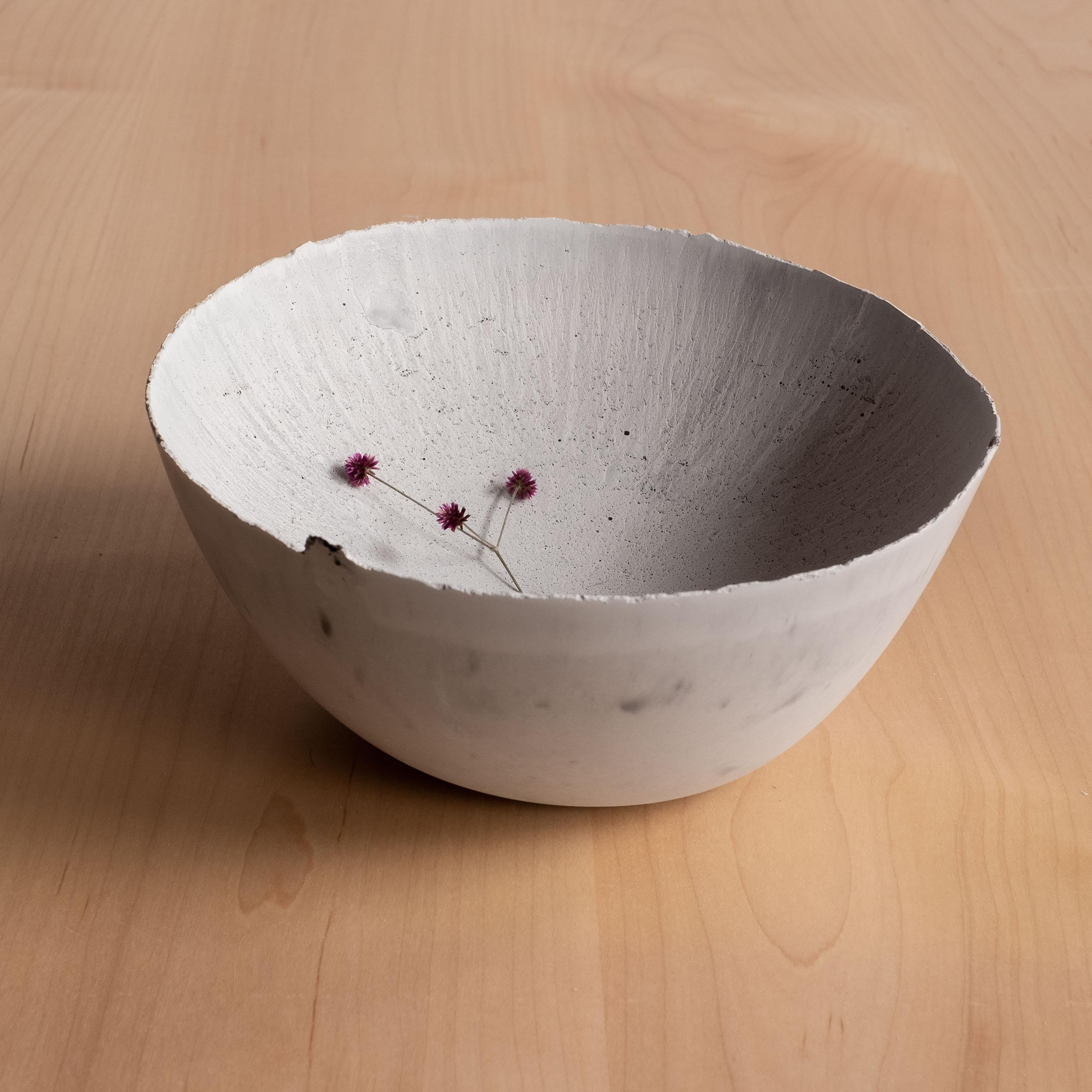 An edition of 150 unique bowls, the Concrete Series by UMÉ Studio expresses the tension between heavy concrete and its delicate edge generated by hand pouring. While one assumes concrete should be strong and durable, it is, at its core, fragile.