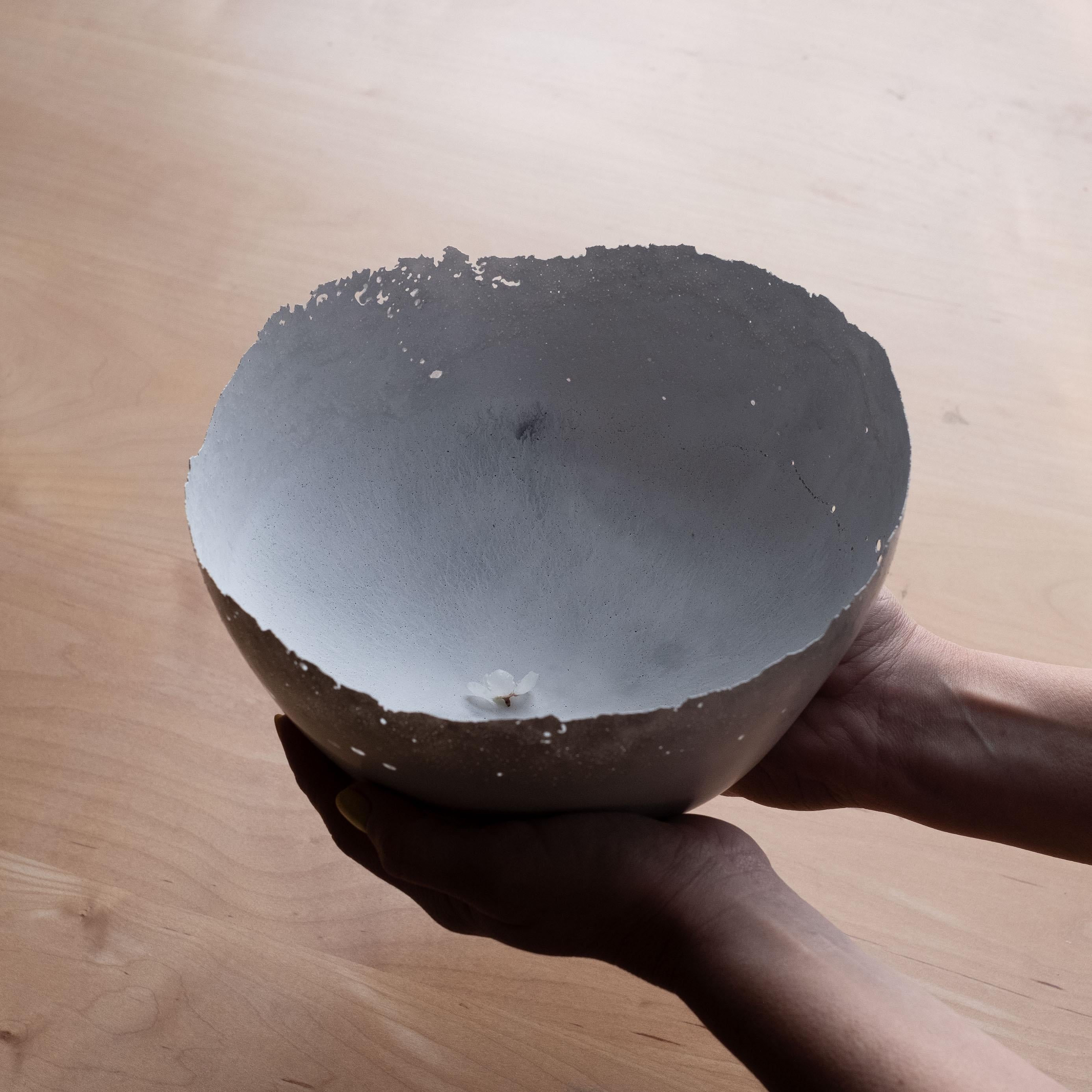An edition of 150 unique bowls, the concrete Series by UMÉ Studio expresses the tension between heavy concrete and its delicate edge generated by hand pouring. While one assumes concrete should be strong and durable, it is, at its core, fragile.
