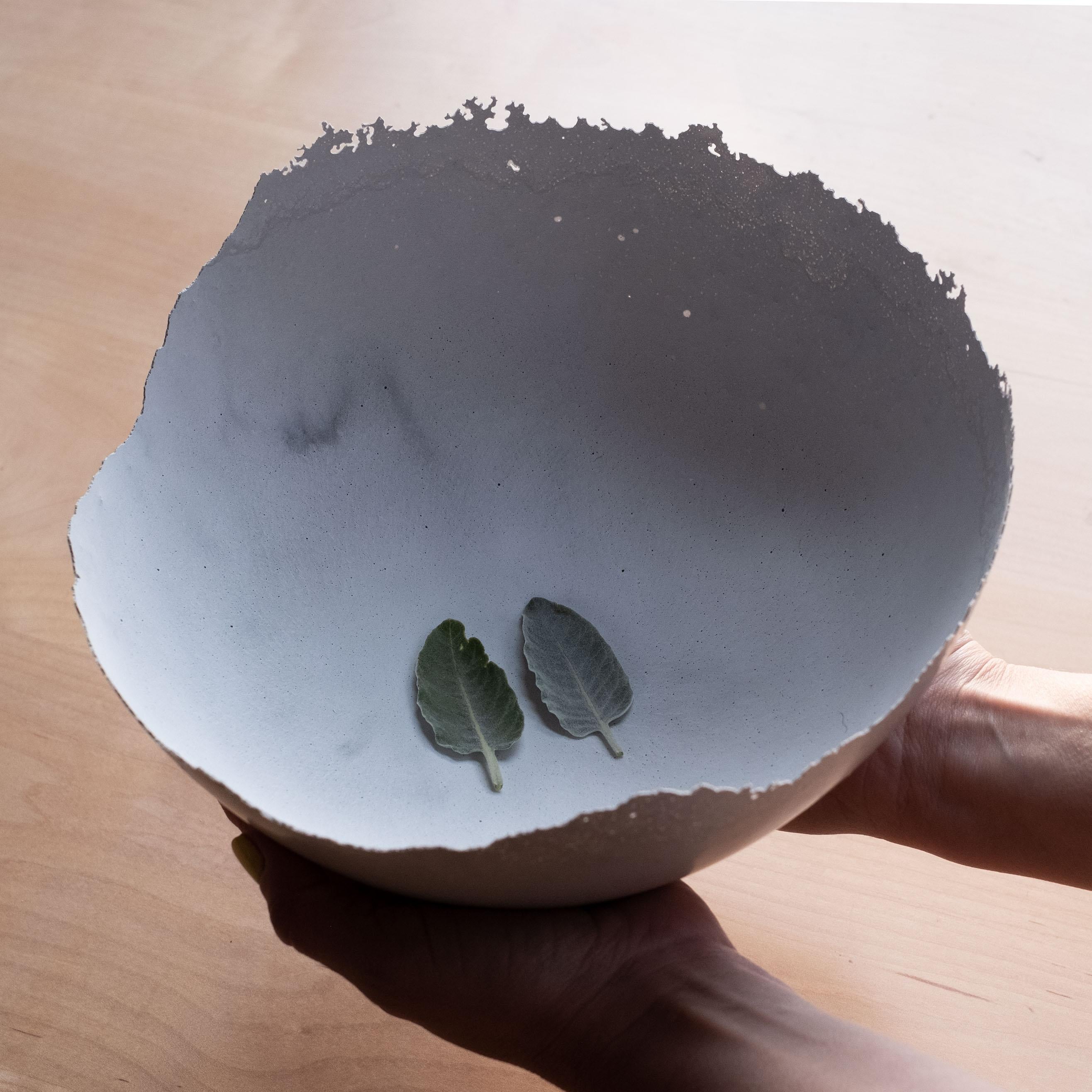 An edition of 150 unique bowls, the concrete Series by UMÉ Studio expresses the tension between heavy concrete and its delicate edge generated by hand pouring. While one assumes concrete should be strong and durable, it is, at its core, fragile.