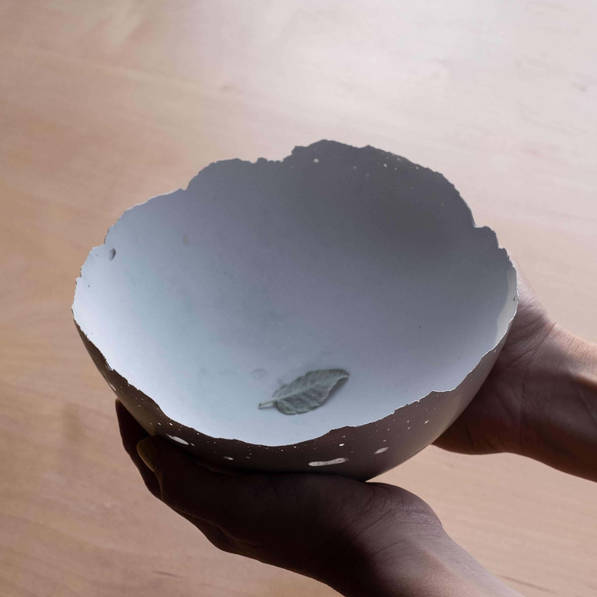 An edition of 150 unique bowls, the concrete Series by UMÉ Studio expresses the tension between heavy concrete and its delicate edge generated by hand pouring. While one assumes concrete should be strong and durable, it is, at its core, fragile.