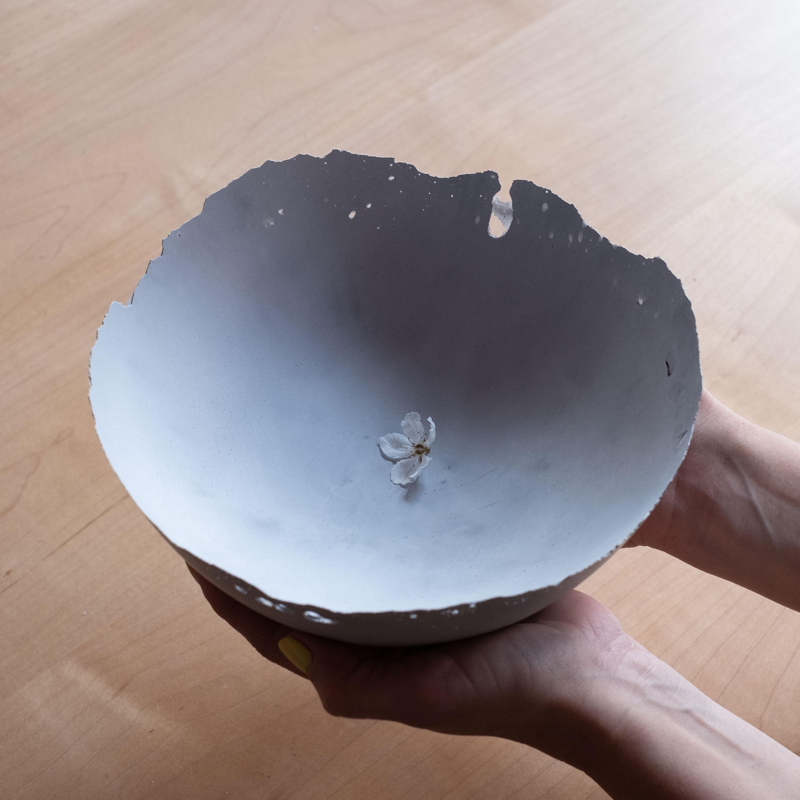 An edition of 150 unique bowls, the concrete Series by UMÉ Studio expresses the tension between heavy concrete and its delicate edge generated by hand pouring. While one assumes concrete should be strong and durable, it is, at its core, fragile.