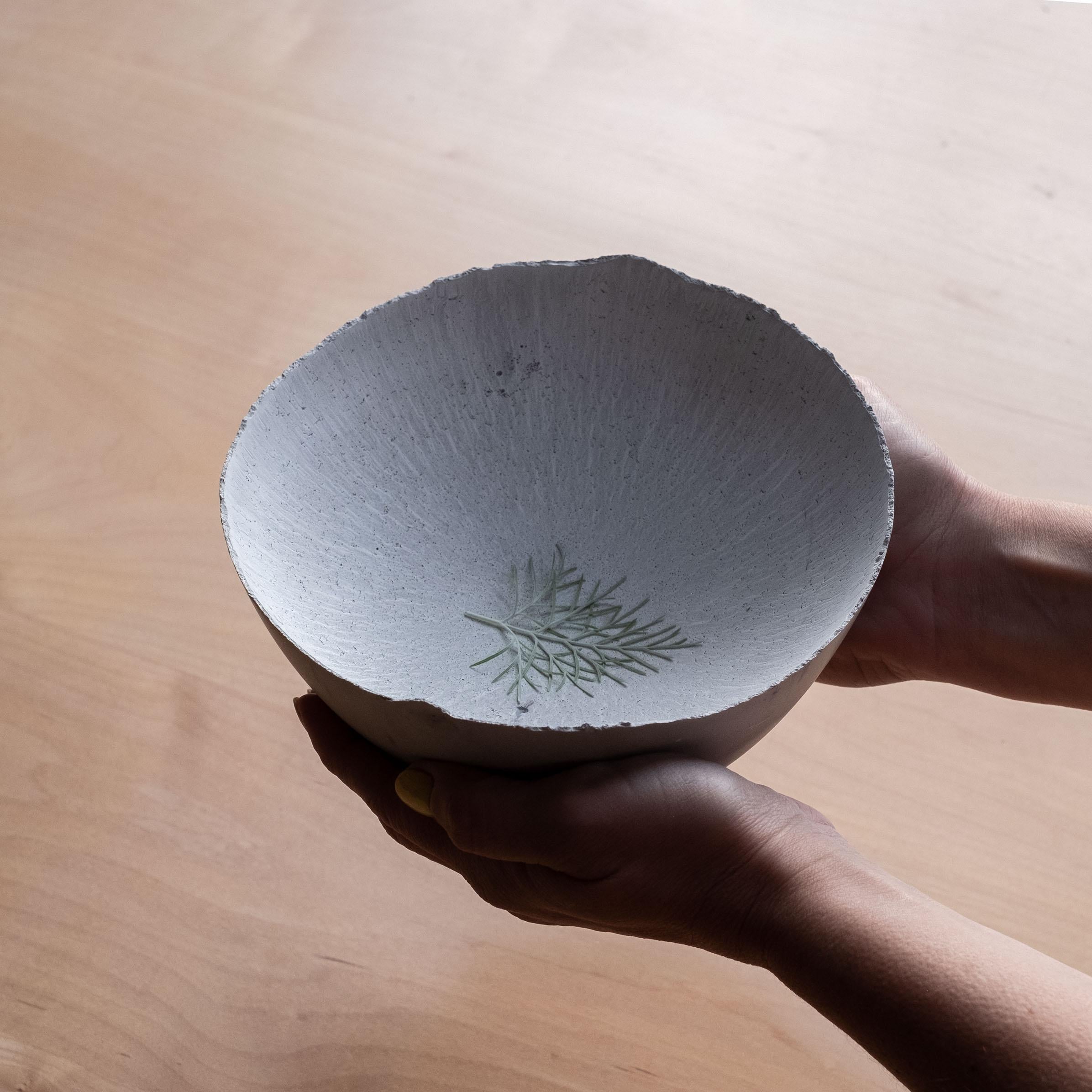 An edition of 150 unique bowls, the concrete Series by UMÉ Studio expresses the tension between heavy concrete and its delicate edge generated by hand pouring. While one assumes concrete should be strong and durable, it is, at its core, fragile.