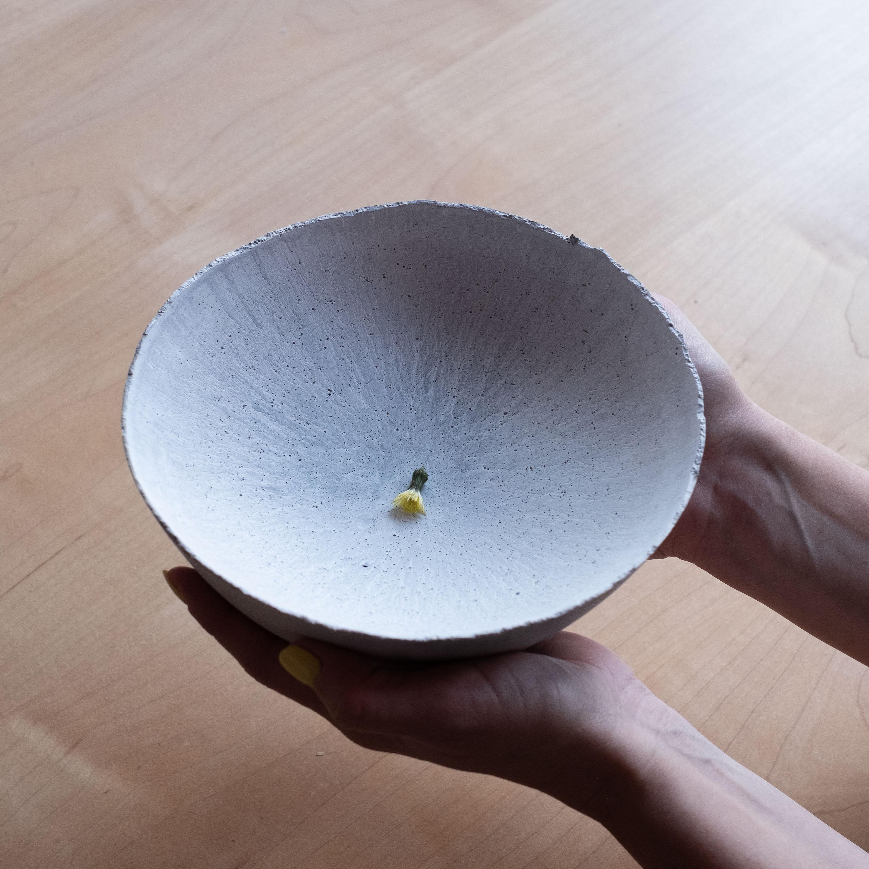 An edition of 150 unique bowls, the concrete Series by UMÉ Studio expresses the tension between heavy concrete and its delicate edge generated by hand pouring. While one assumes concrete should be strong and durable, it is, at its core, fragile.
