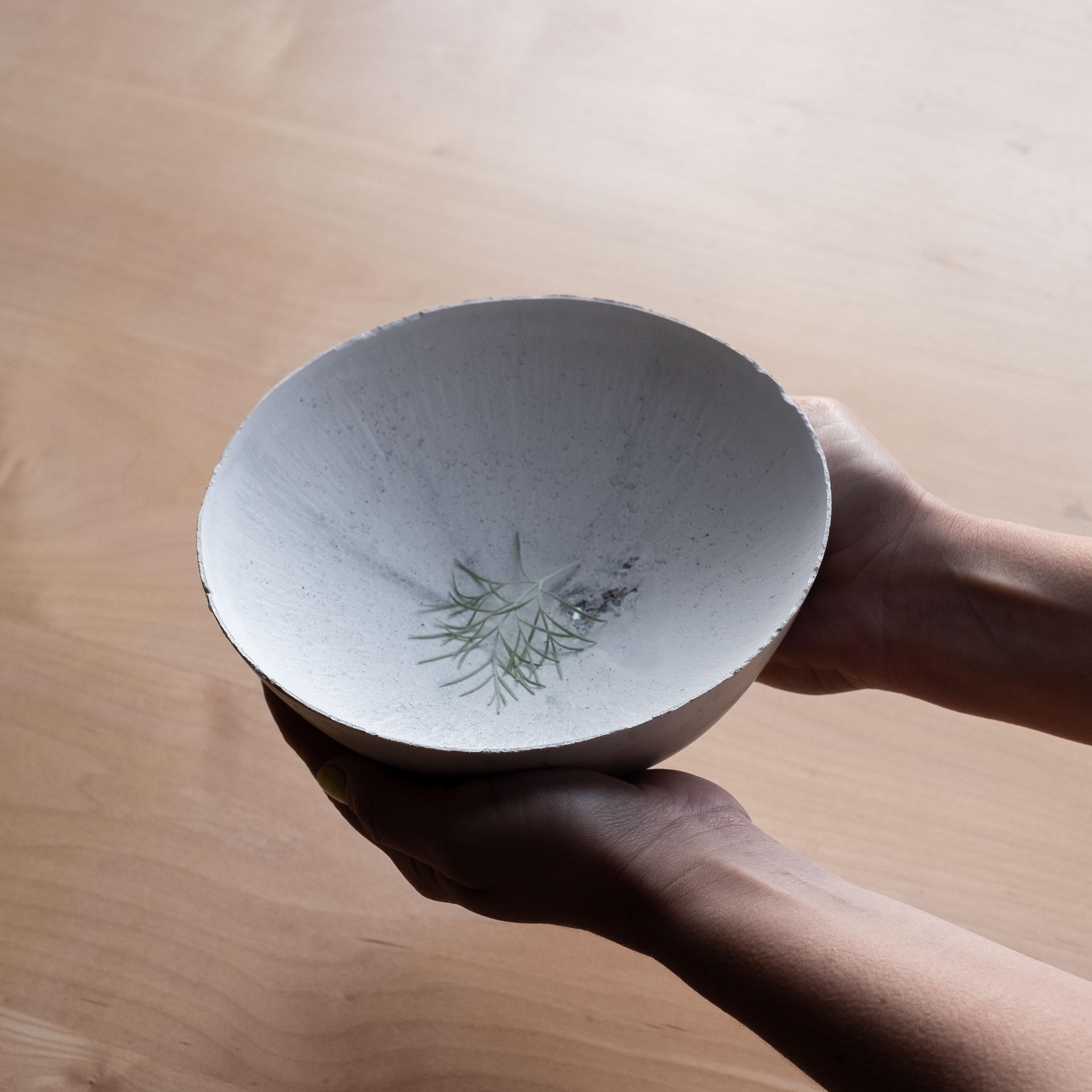 An edition of 150 unique bowls, the concrete Series by UMÉ Studio expresses the tension between heavy concrete and its delicate edge generated by hand pouring. While one assumes concrete should be strong and durable, it is, at its core, fragile.