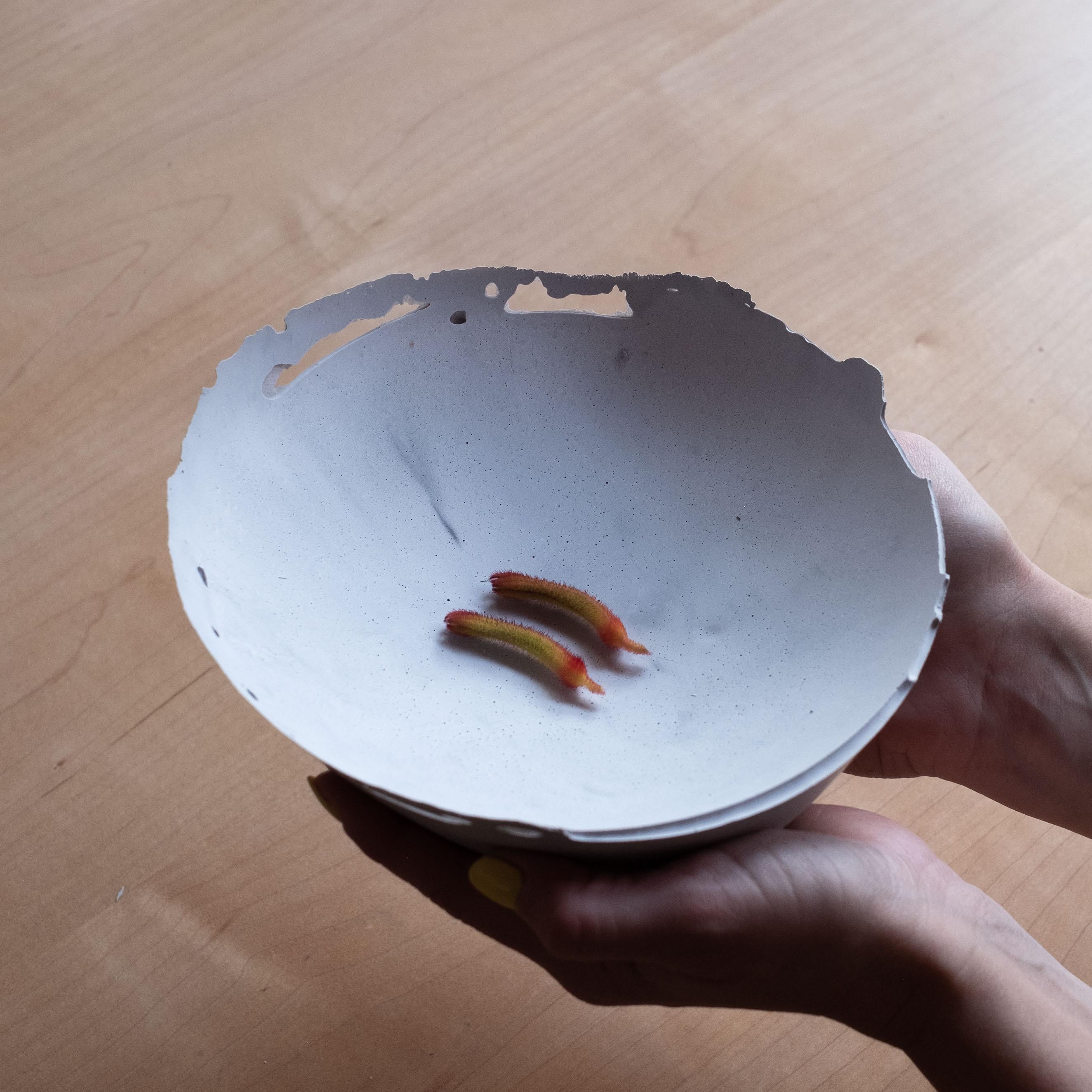 An edition of 150 unique bowls, the concrete Series by UMÉ Studio expresses the tension between heavy concrete and its delicate edge generated by hand pouring. While one assumes concrete should be strong and durable, it is, at its core, fragile.