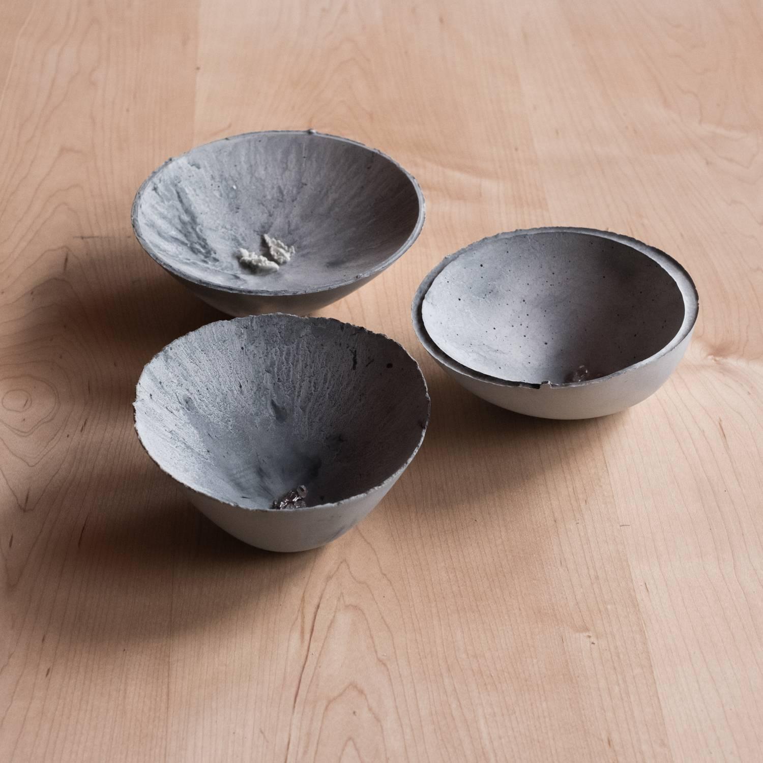 A collection of 200 unique bowls, the Concrete Series by UMÉ Studio expresses the tension between heavy concrete and its delicate edge generated by hand pouring. While one assumes concrete should be strong and durable, it is, at its core, fragile.