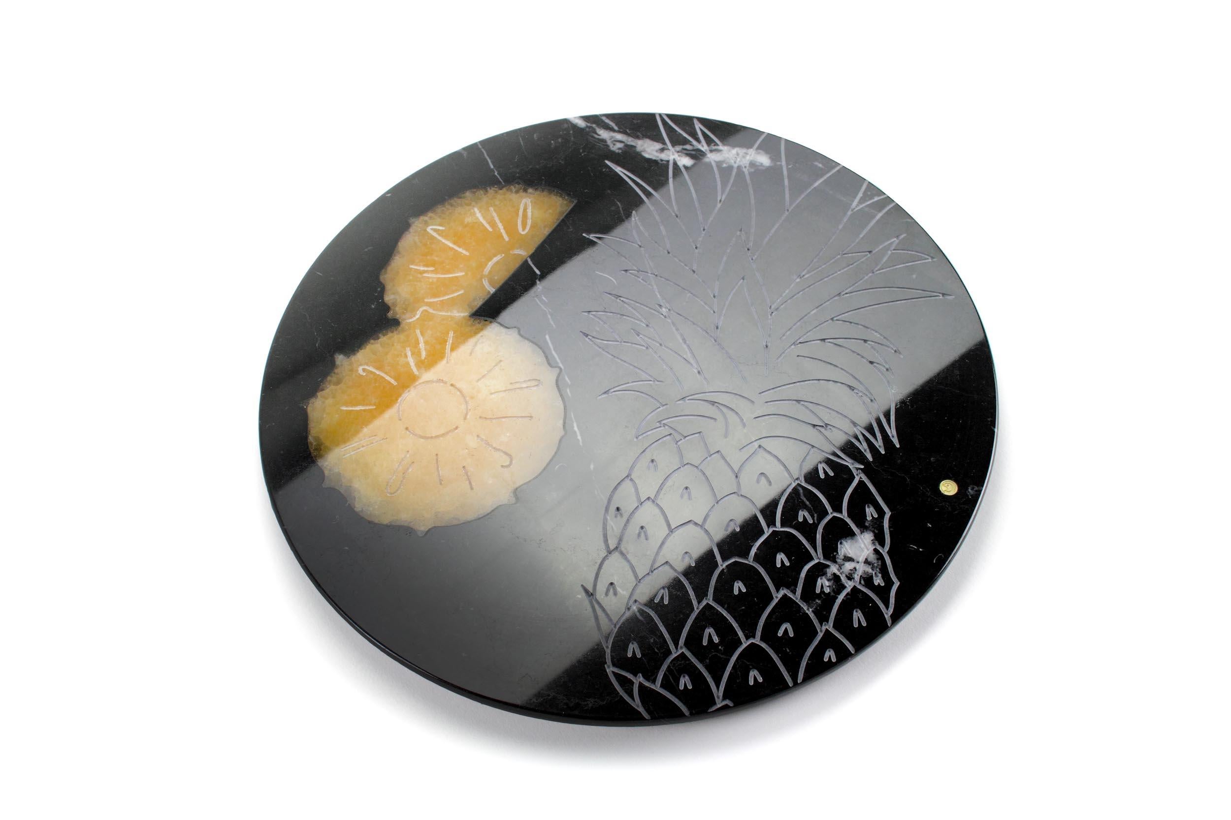 Centerpiece/serving plate in Marquina marble with honey onyx inlay.

Dimensions: D 33, H 1.5 cm

100% Hand made in Italy. 

Marble is a natural material, every piece is unique as each marble block is different in veins and color shades. All of our