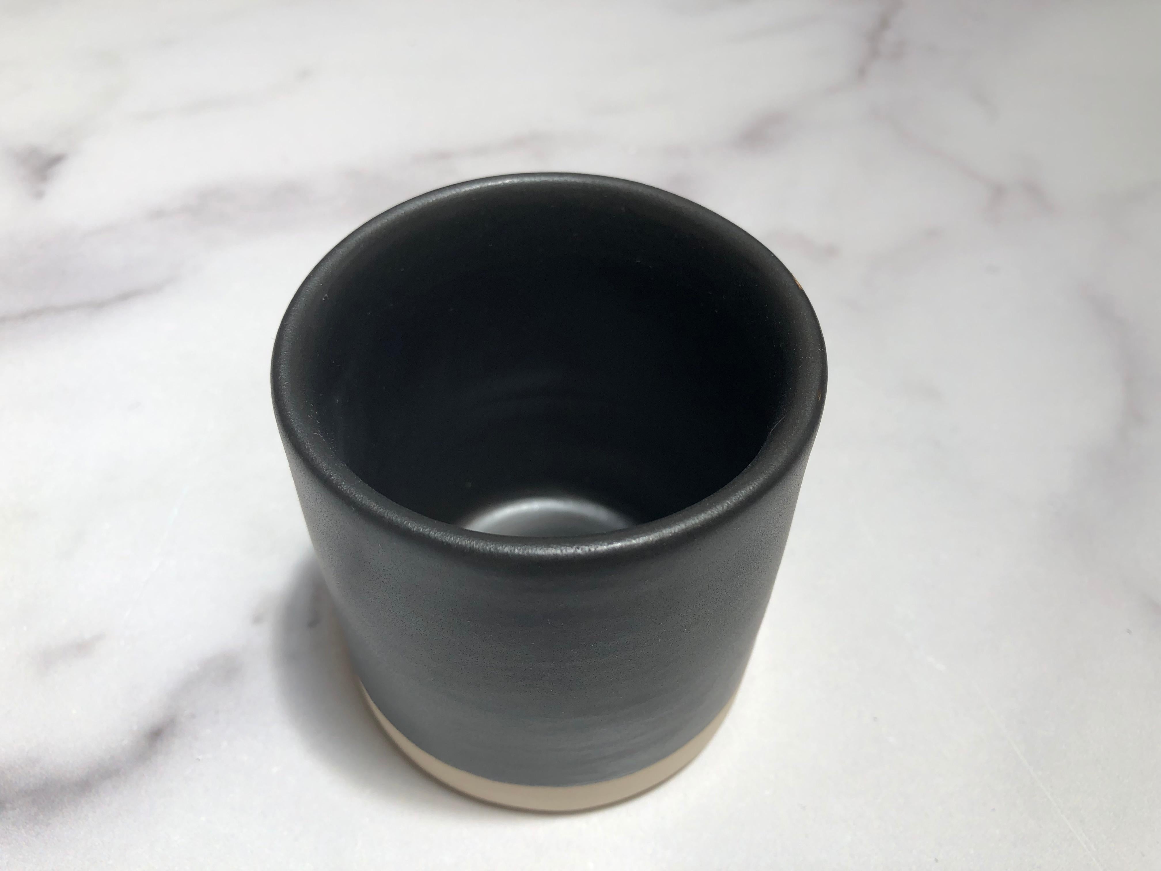 Handmade and hand painted ceramics from one of the mother countries, Portugal, these beautiful pieces for your table will add a modern touch and are perfect to mix and match. This tumbler comes in black or white.

Size: 3.25” height