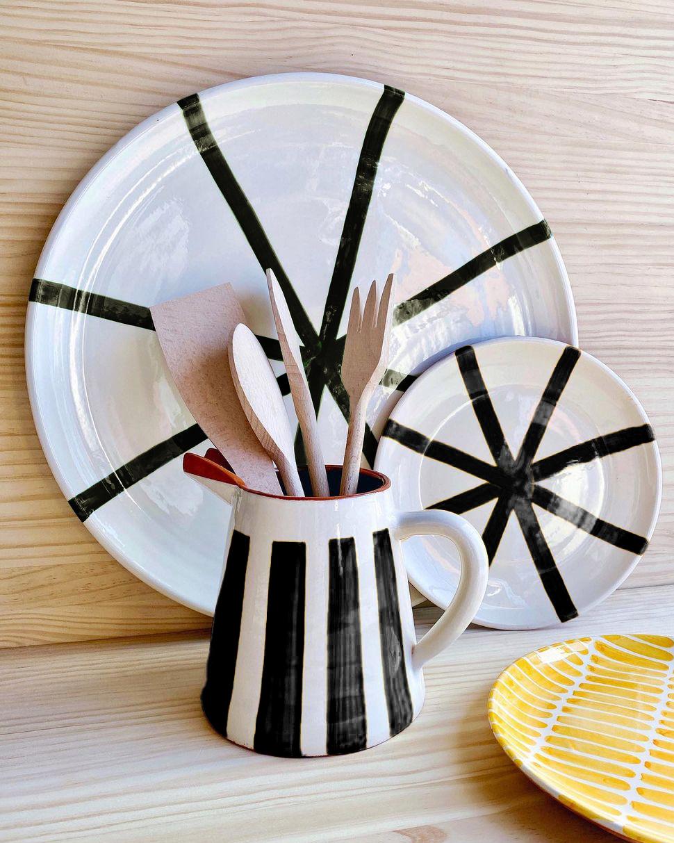 A bold graphic platter for your dining table. Host a dinner party to remember with the Casa Cubista Large Segment Platter! Perfect for hors d'oeuvres, small bites, and charcuterie, this terracotta and black/white striped board is not only