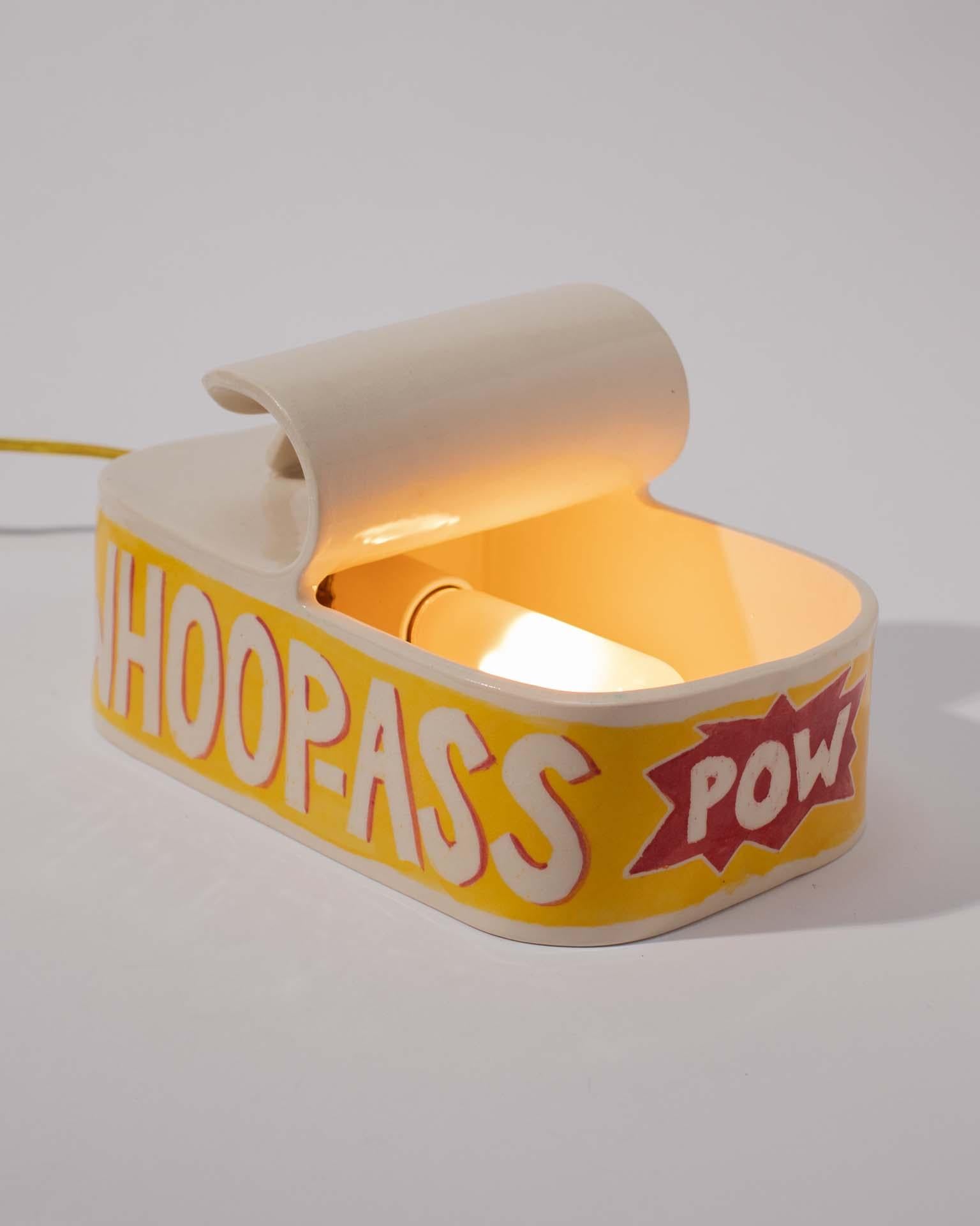 Ever wanted to open up a can of whoop-ass on someone? Well now you can!
Plus, it'll add some playful, warm light to whatever space you place it in—a true win-win scenario! 

The Whoop-Ass Can Lamp, created by Ethan Streicher, the founder and artist