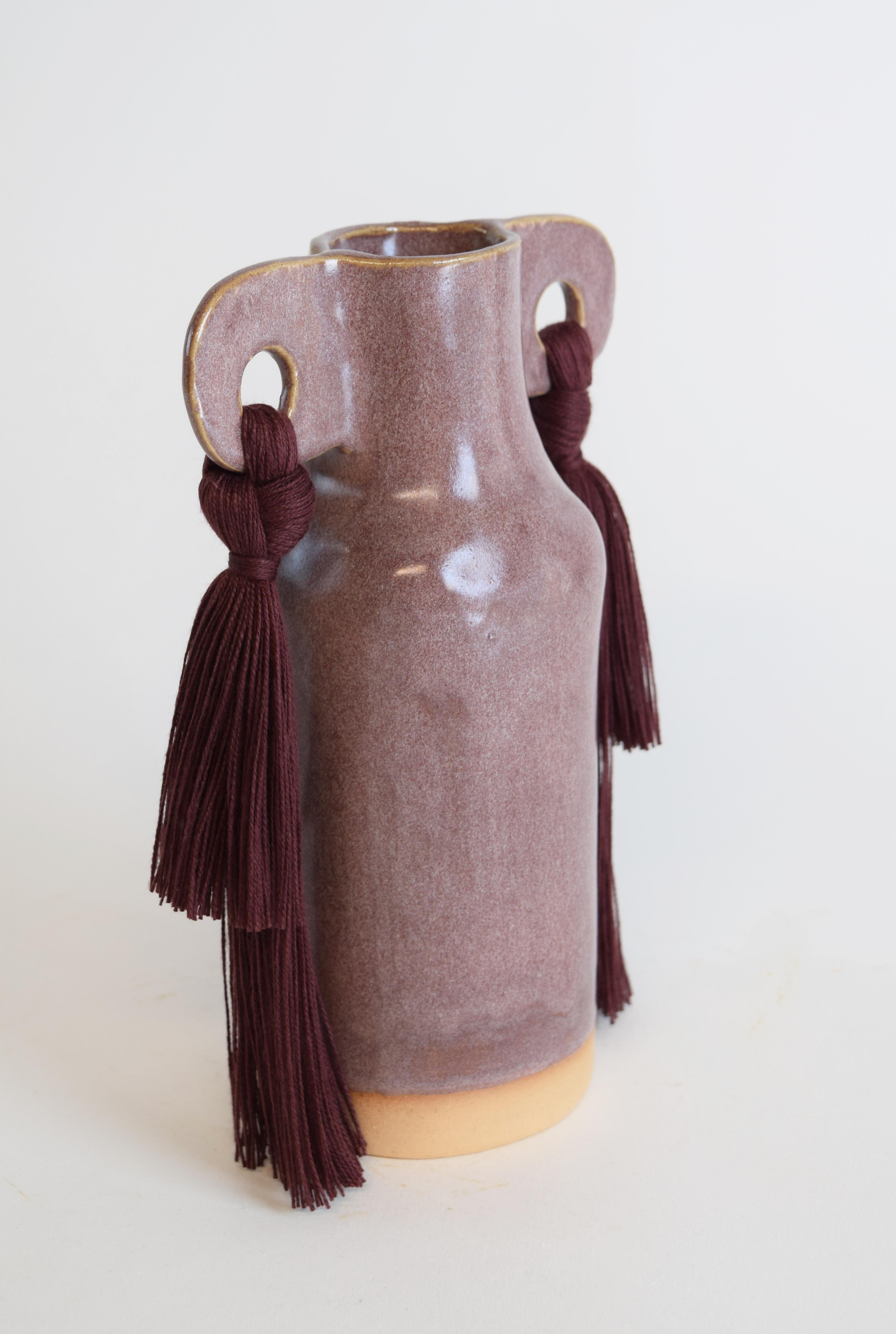 Vase #606 by Karen Gayle Tinney

A petite vase perfectly sized to stand alone in a small space or act as a companion to a larger piece. Each vase is formed by hand, making every piece unique.

Stoneware with light burgundy glaze. Burgundy cotton