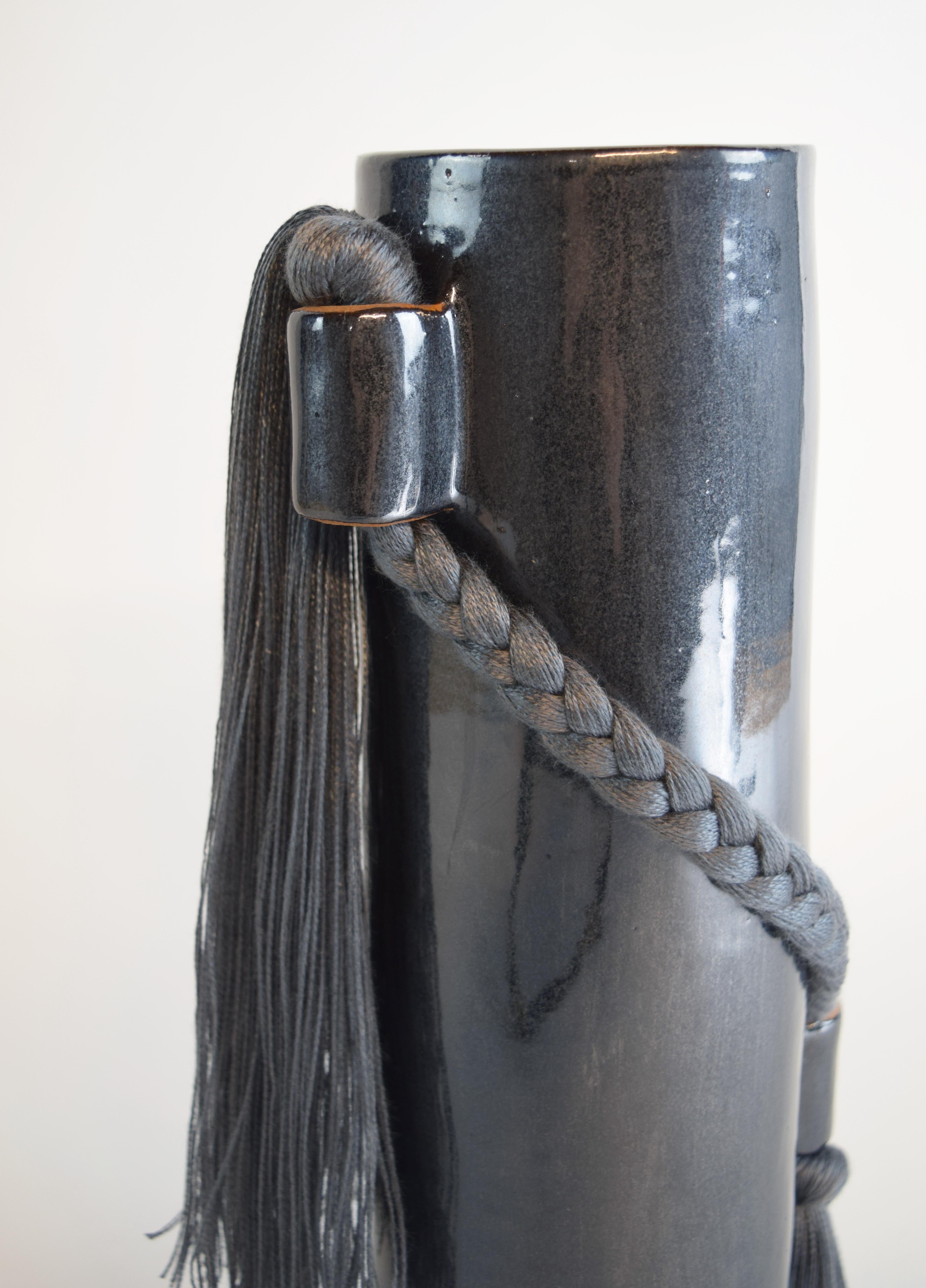 Vase #695 by Karen Gayle Tinney

Equal parts functional and sculptural, this vase is the perfect size for a small bouquet but packs enough detail for it to stand alone as a decorative object on a shelf or table.

Hand formed stoneware with black