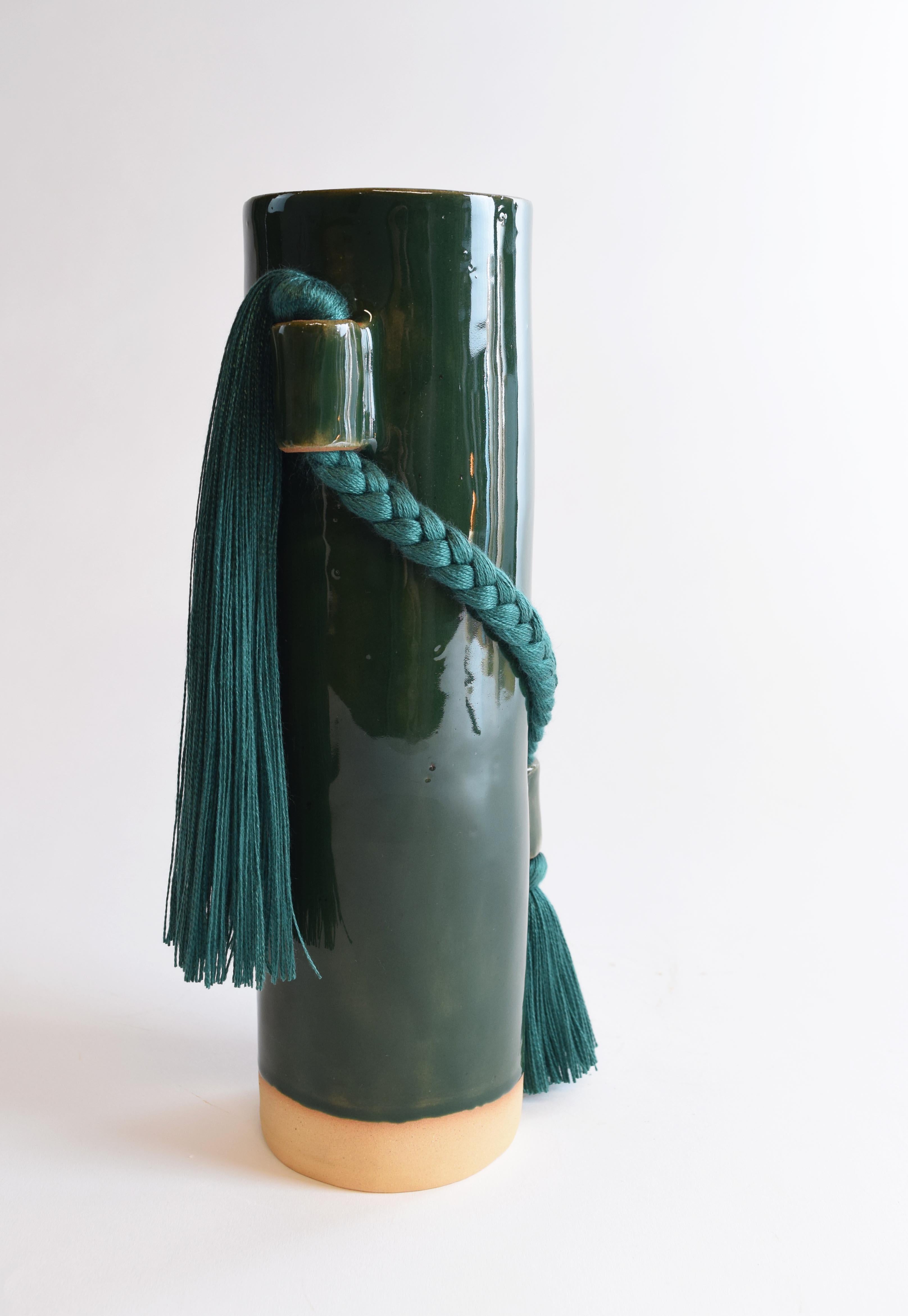 Vase #695 by Karen Gayle Tinney

Equal parts functional and sculptural, this vase is the perfect size for a small bouquet but packs enough detail for it to stand alone as a decorative object on a shelf or table.

Hand formed stoneware with dark