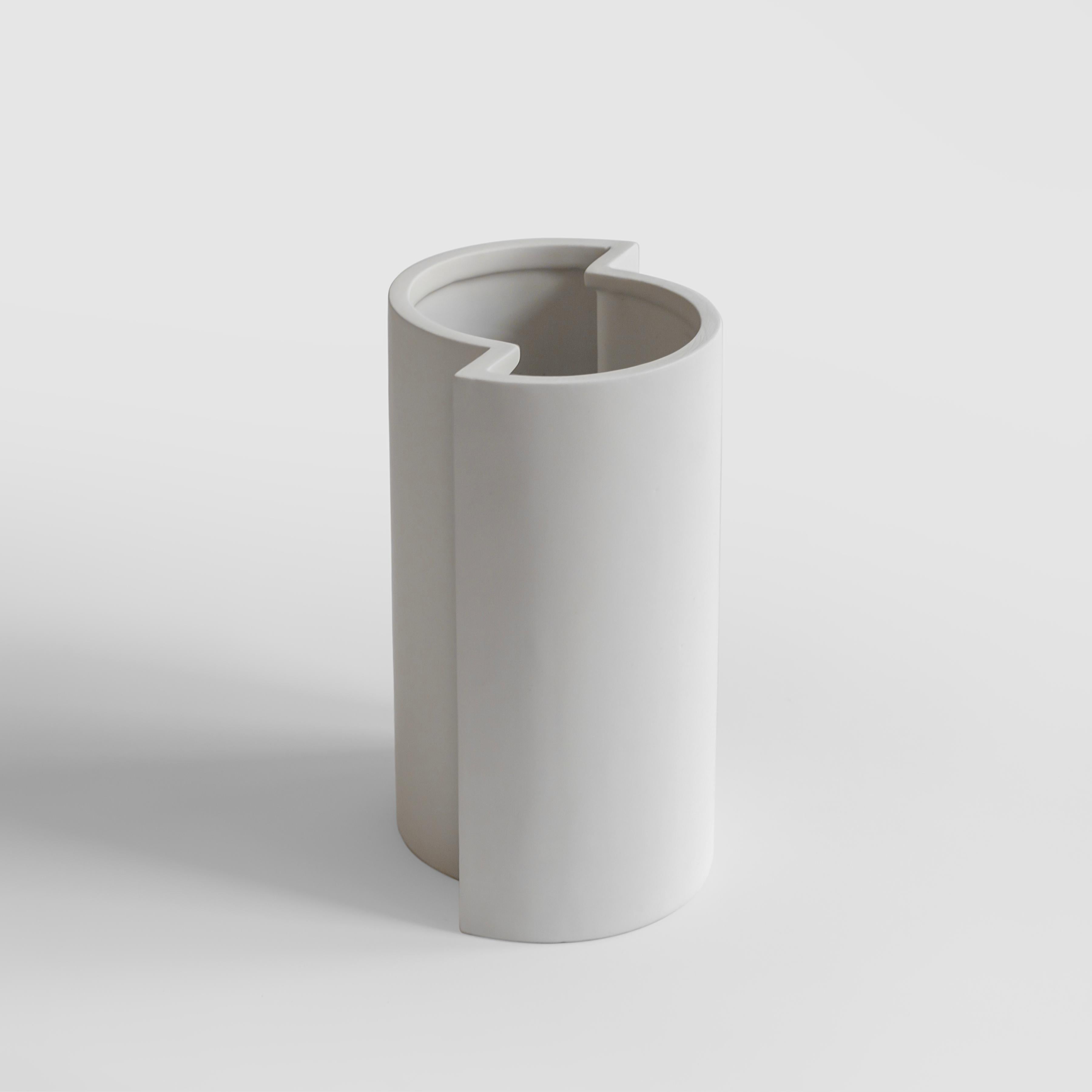 A minimalist and playful vase in slip-cast ceramic with a white matt crystalline glaze, the piece is handmade in Milan.
Part of the 
