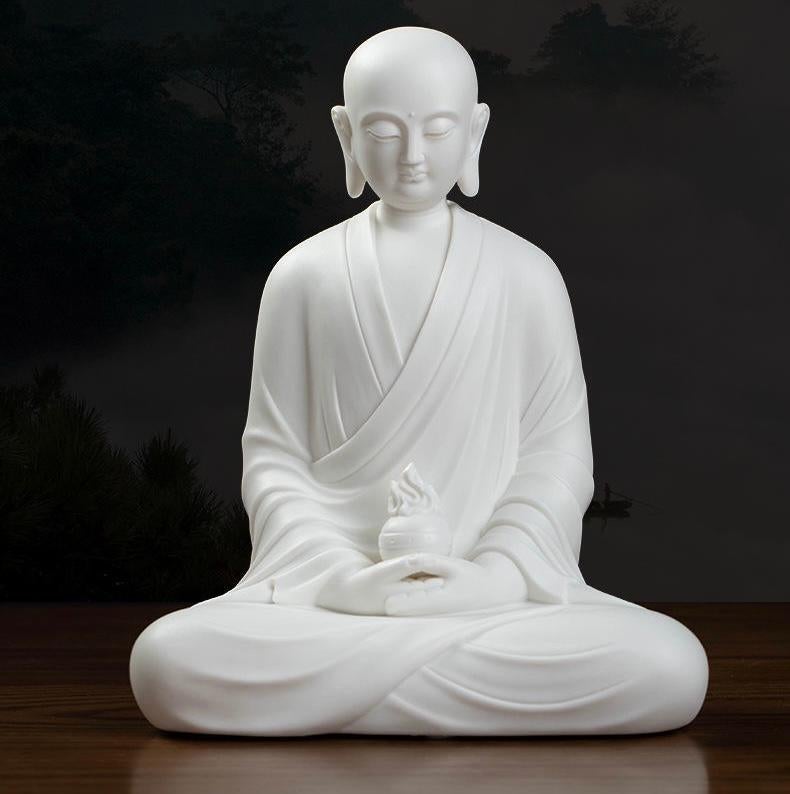 This 20th Century Chinese Handmade White Porcelain Statue presents the Kṣitigarbha (Dizang) Bodhisattva seated in serene meditation, embodying deep compassion and unwavering resolve. Known as the protector of beings in the six realms, Kṣitigarbha is