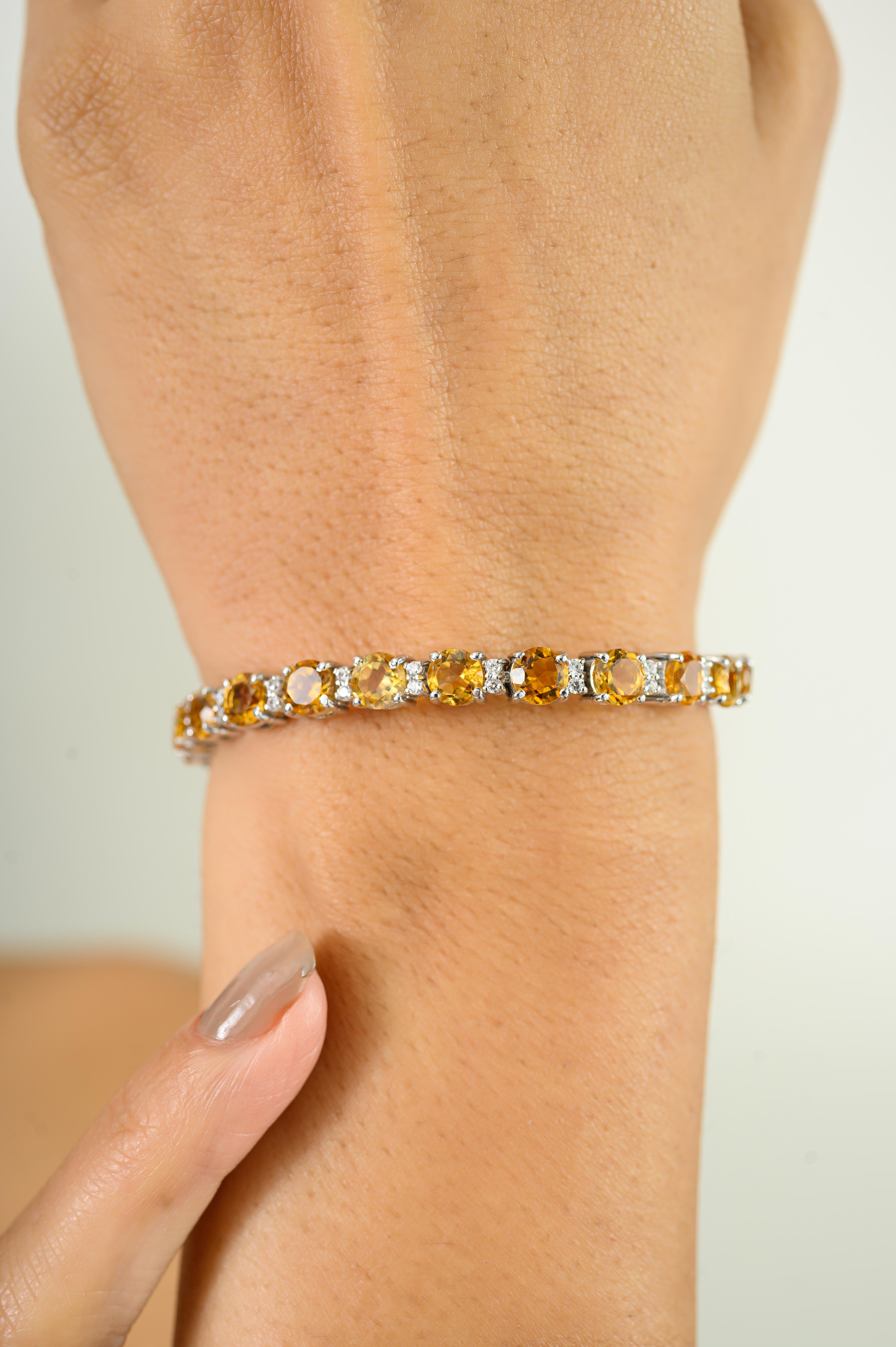 Tennis Handmade Citrine Tennis Bracelet features a series of round-cut natural citrine gemstones, set in 925 sterling silver. The citrines total 12.61 carats and are meticulously faceted to capture and reflect light with every movement. Each stone