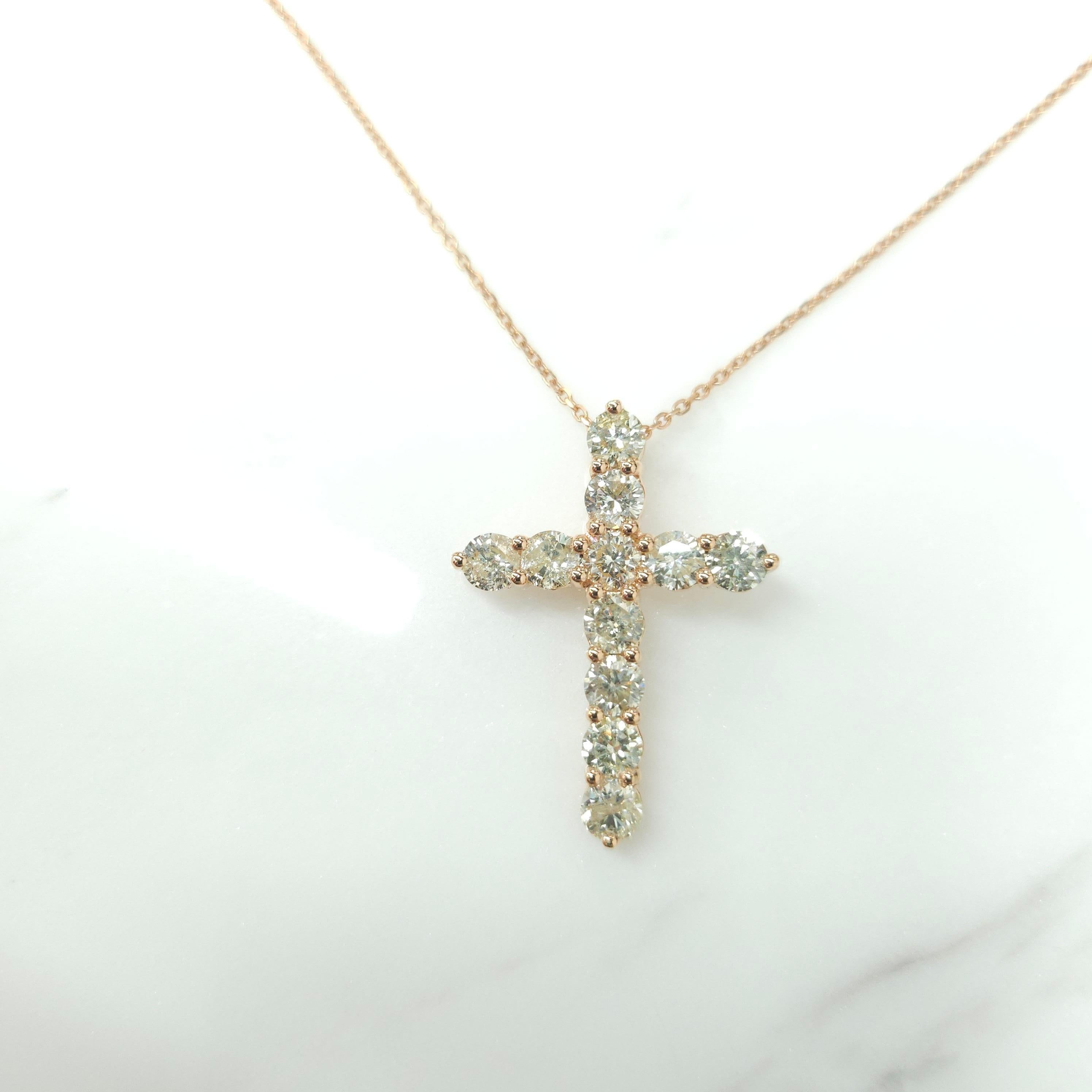 A precious interpretation of a classic motif, our cross pendant in 18K rose gold is available in a variety of different carat weights, seen here with 0.23 carat diamonds. Deftly suspended from a gold chain, each diamond is embraced by a minimal