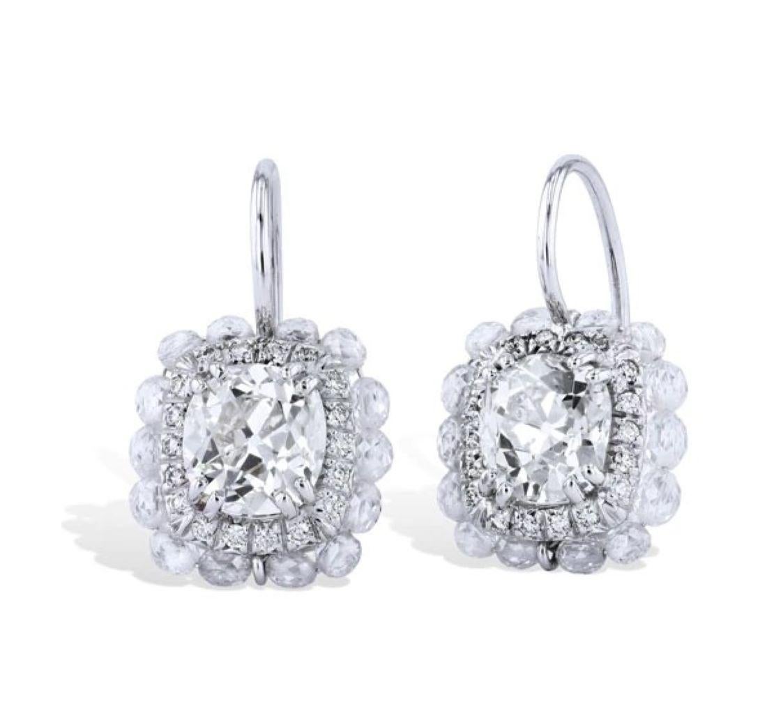 These stunning earrings are handmade and are so beautiful.

They feature 2.52 total weight old mine cut diamonds in the center with an additional 2.27 total weight diamond beads around the perimeter, that are G/H in color. There is also an