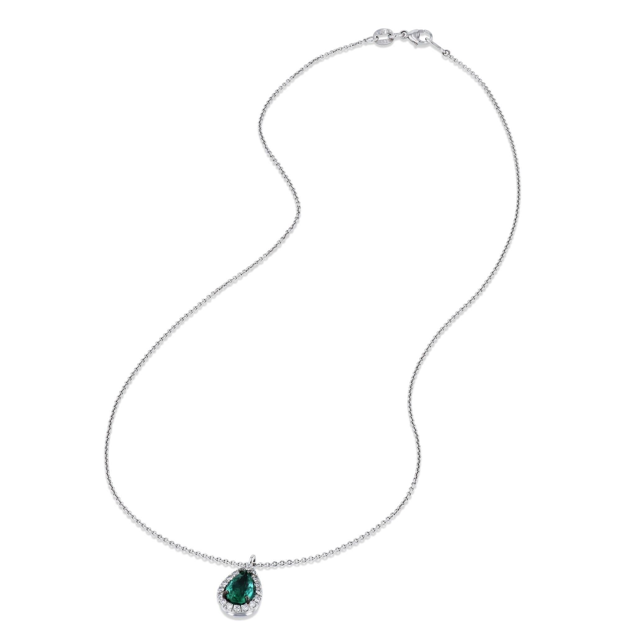 Delight in the exquisite craftsmanship of the 18K white gold diamond Colombian Emerald pendant necklace. This luxurious piece features a 0.83 carat pear-shaped emerald, with 17 sparkling diamonds. The delicate cable link chain is a perfect
