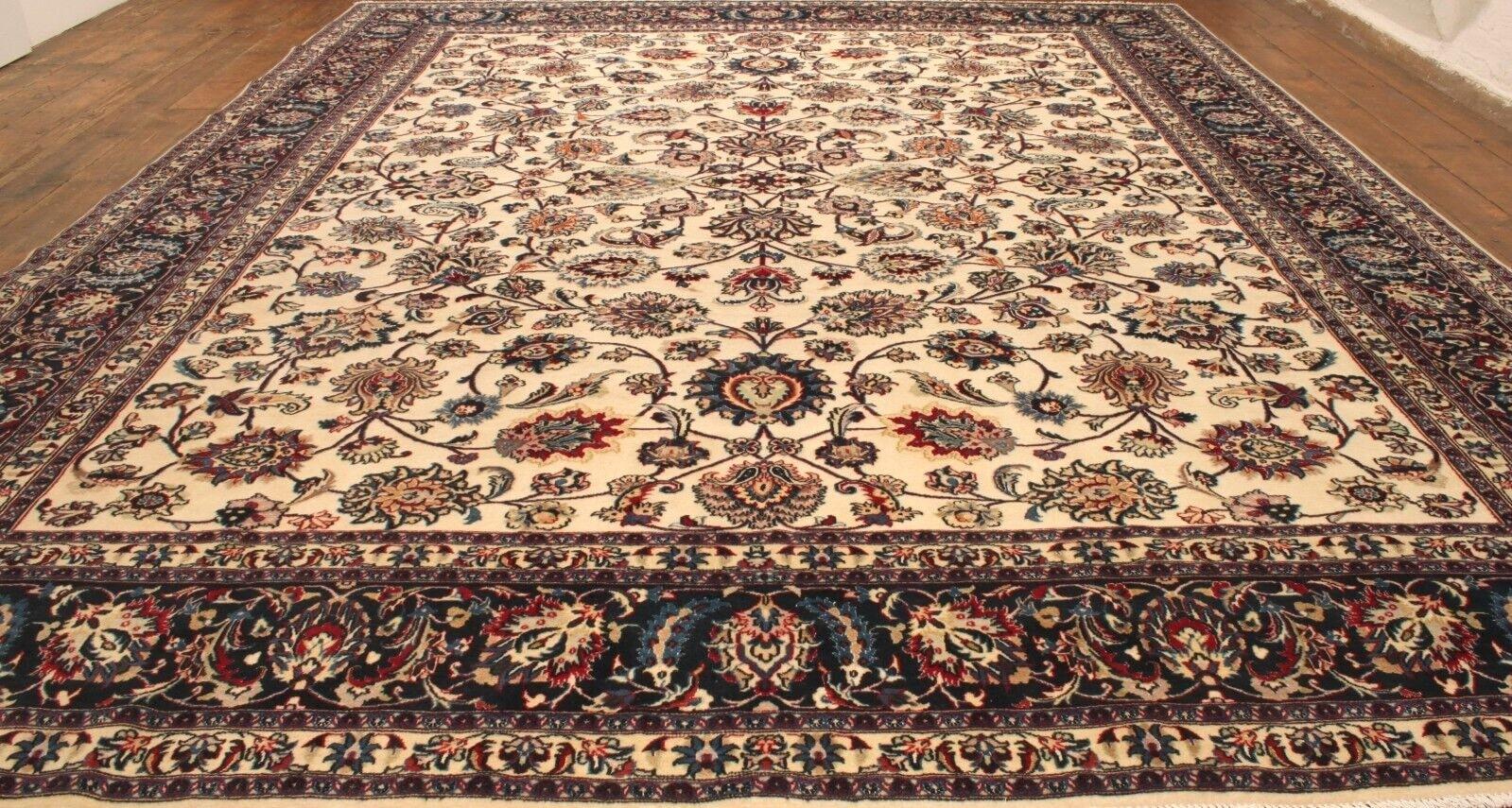 Transform your space with the luxurious charm of our Handmade Contemporary Persian Style Tabriz Rug, a masterpiece from the 2000s. Measuring at 10' x 12.7', this rug boasts an all-over floral design on a light beige background, adding a touch of