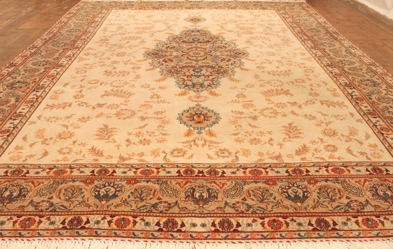 Elevate your living space with the refined simplicity of our Handmade Contemporary Persian Style Tabriz Rug, a stunning creation from the 2000s. Measuring at 8.9' x 12.8' (273cm x 393cm), this rug features a beautiful beige color, showcasing one
