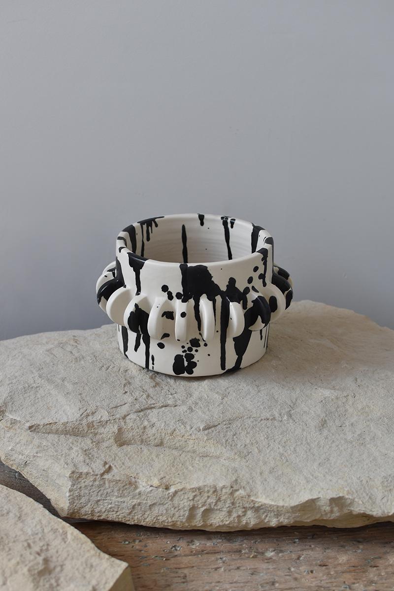 Beautiful handmade ceramic planter, perfect for accentuating the beauty of your houseplants.

Each ceramic plant pot is individually thrown and trimmed on the wheel, glazed by hand in a matte glaze, and each splatter and brushstroke is hand-painted