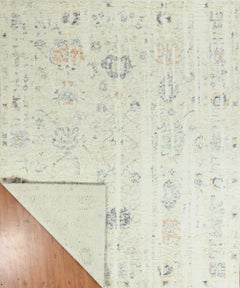 Handmade Contemporary Vintage-Style Wool Rug in Ivory, Subtle Multicolor Accents