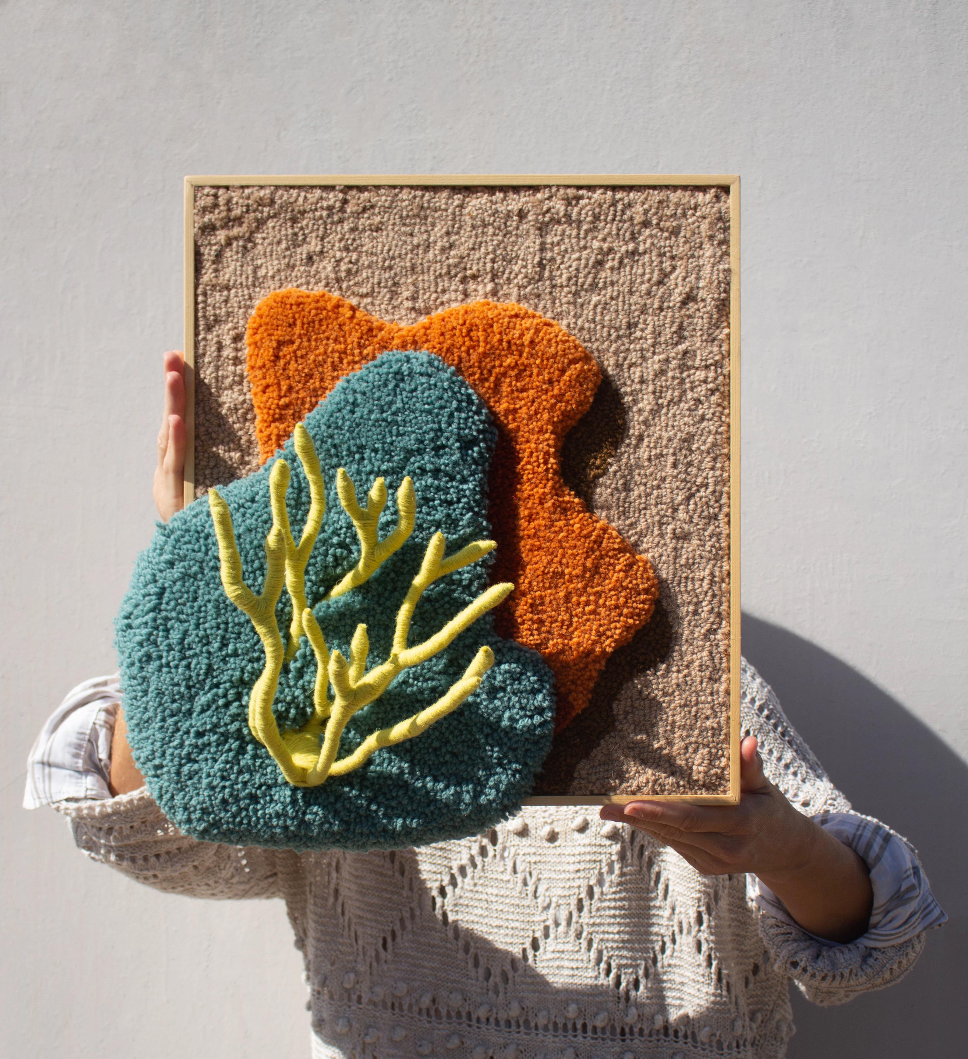 Anthozoa Lima Tapestry is handmade with 100% Portuguese wool yarn, using tufting gun, carving and textile sculpture techniques. It has a 3D sculpture element and the pine frame, as part of the composition, is designed and produced by the studio.