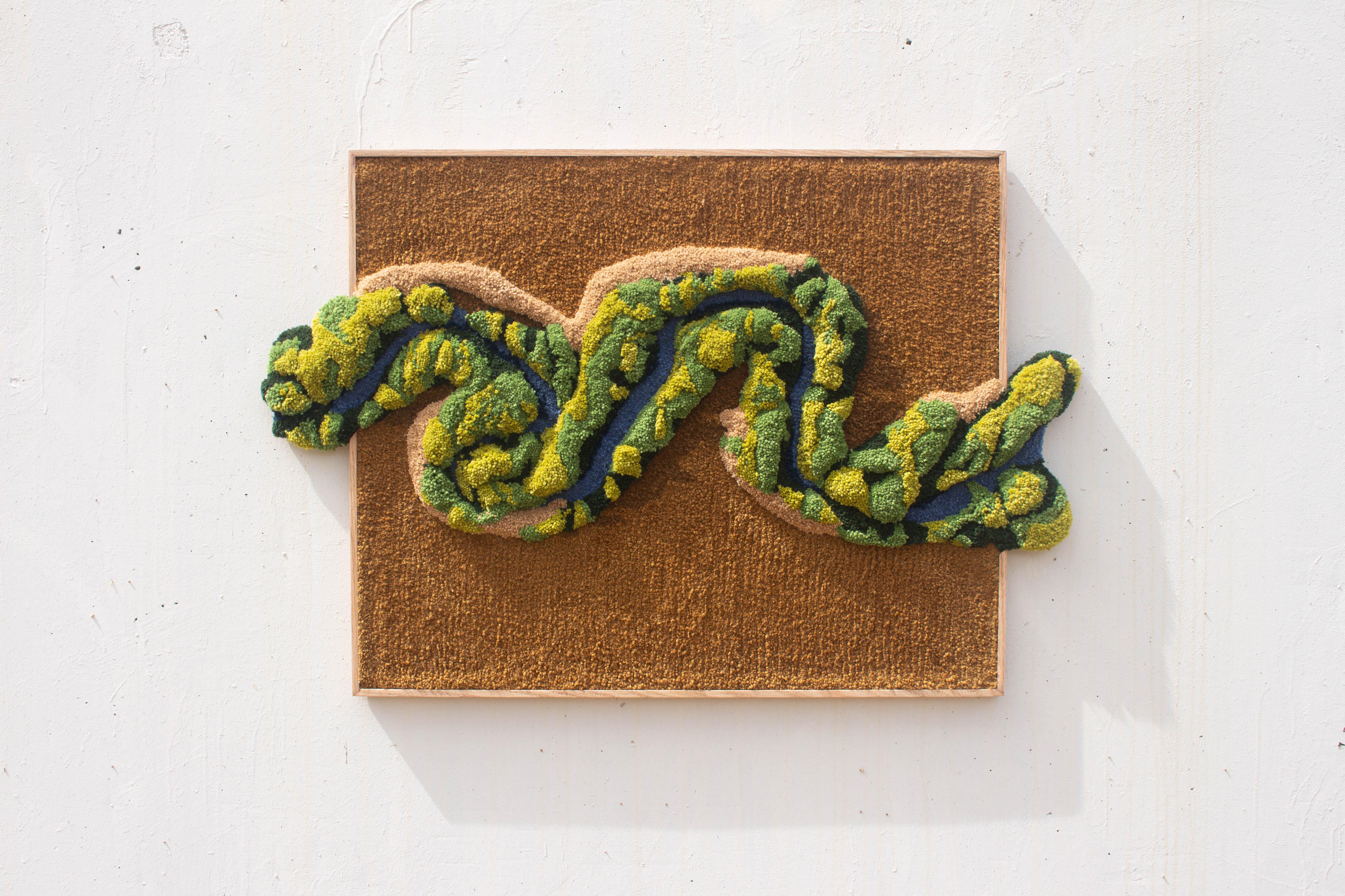Inspired by nature, River Flow II is a one of a kind artwork. Explores the importance of water in life. Handmade with 100% Portuguese wool yarn, using tufting gun and carving techniques. The oak frame is designed and produced by the studio.

Estudio
