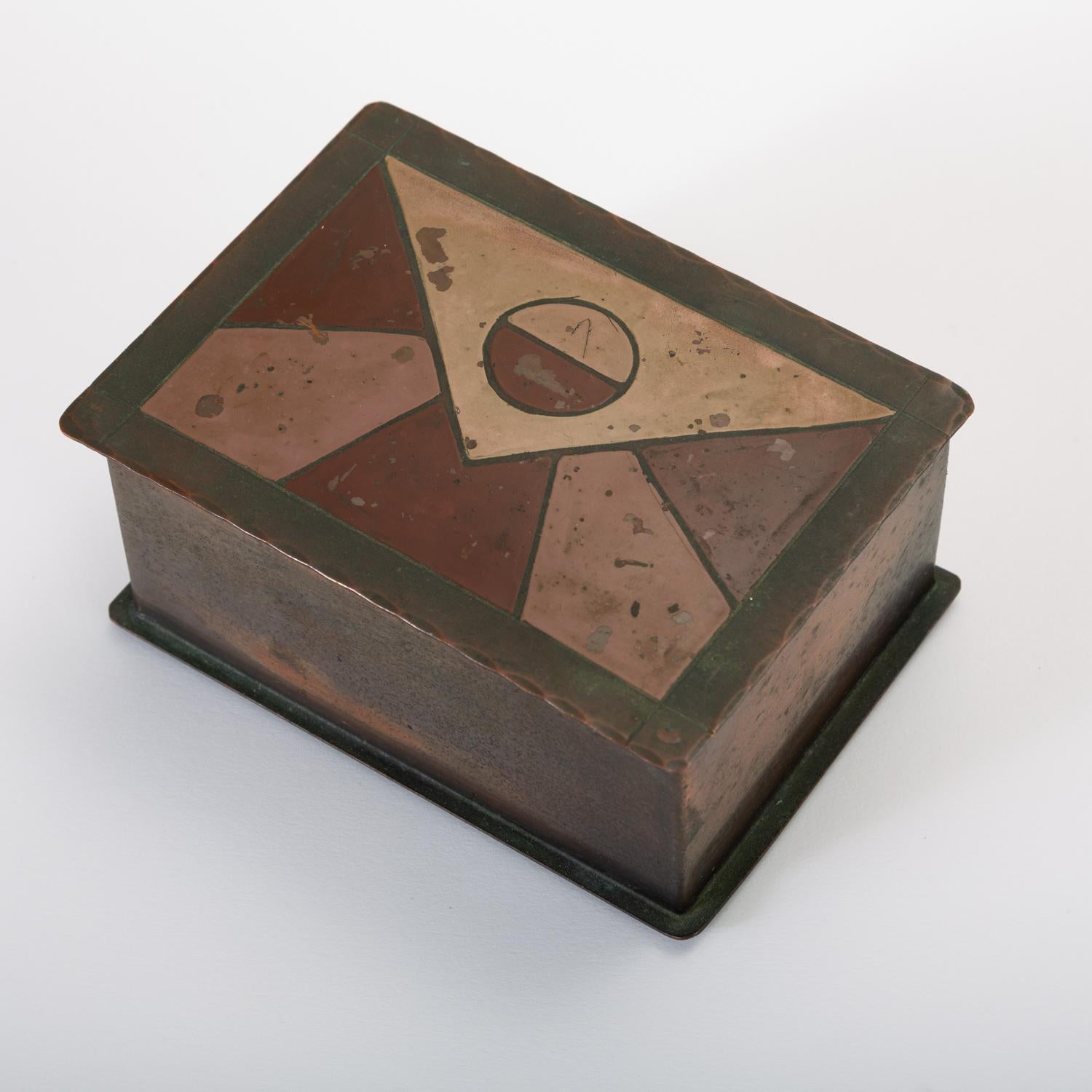 A California-made modern jewelry or decorative box with a painted lid from Laguna Beach workshop Craftsman Studios. Interior is laminated with a thin redwood lining. Stamped by manufacturer on underside. 

Condition: Good original condition; brass
