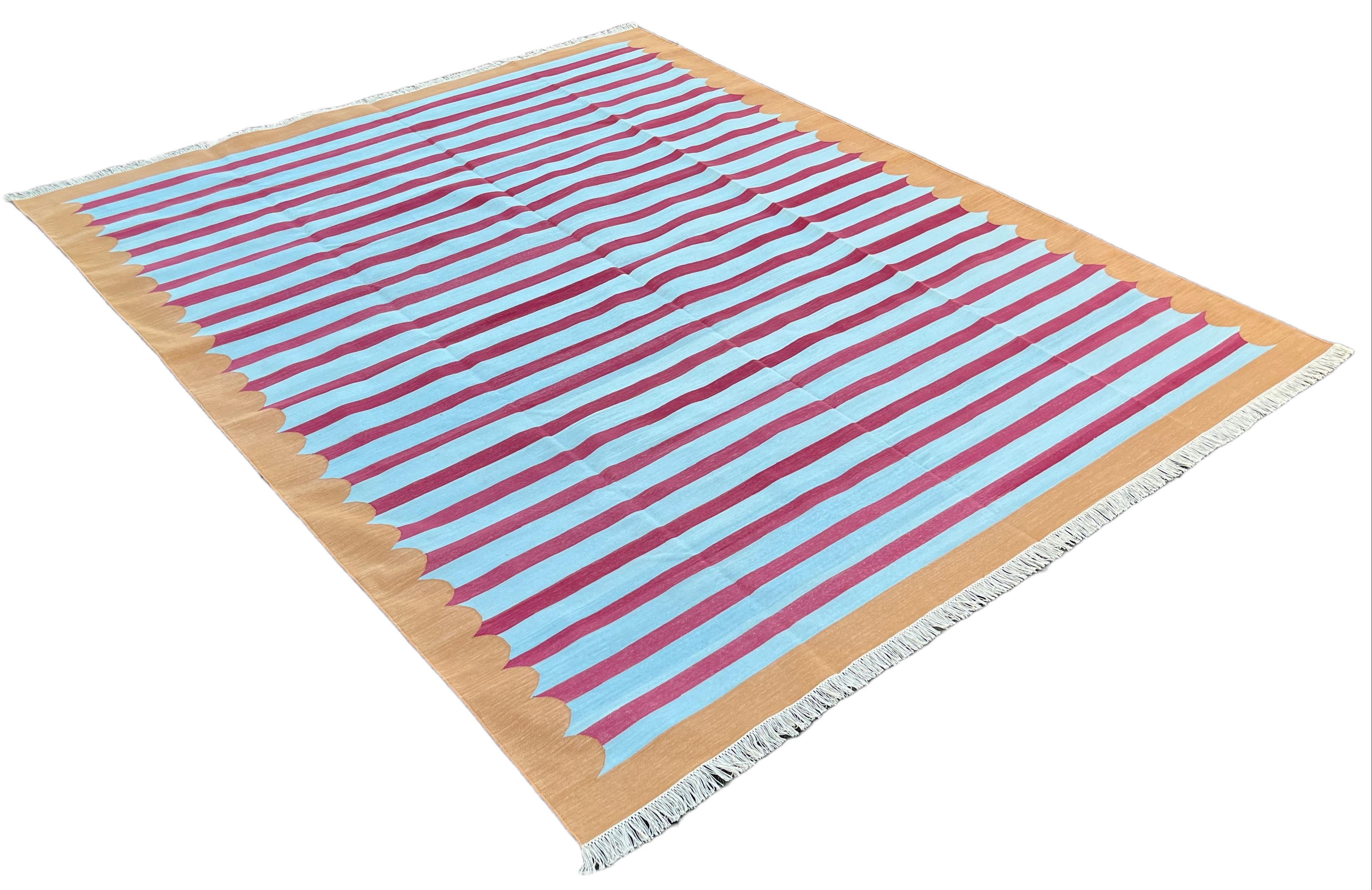 Cotton Natural Vegetable Dyed, Sky Blue, Raspberry Pink And Tan Striped Indian Rug - 10'x14'

These special flat-weave dhurries are hand-woven with 15 ply 100% cotton yarn. Due to the special manufacturing techniques used to create our rugs, the