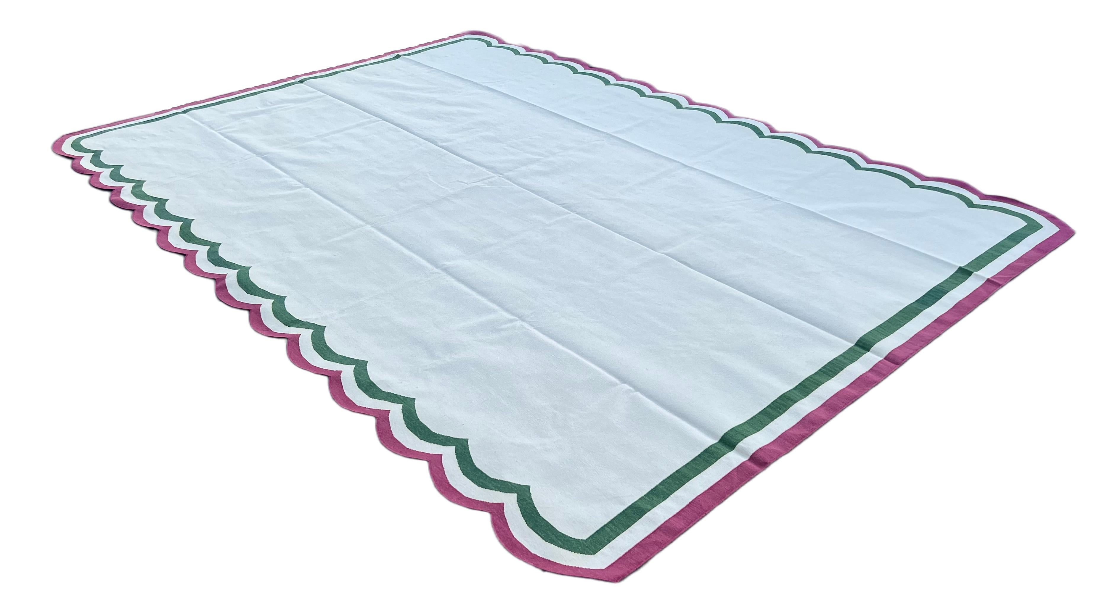 Cotton Vegetable Dyed Reversible Cream, Green And Raspberry Pink Indian Scalloped Rug - 10'x14'
These special flat-weave dhurries are hand-woven with 15 ply 100% cotton yarn. Due to the special manufacturing techniques used to create our rugs, the