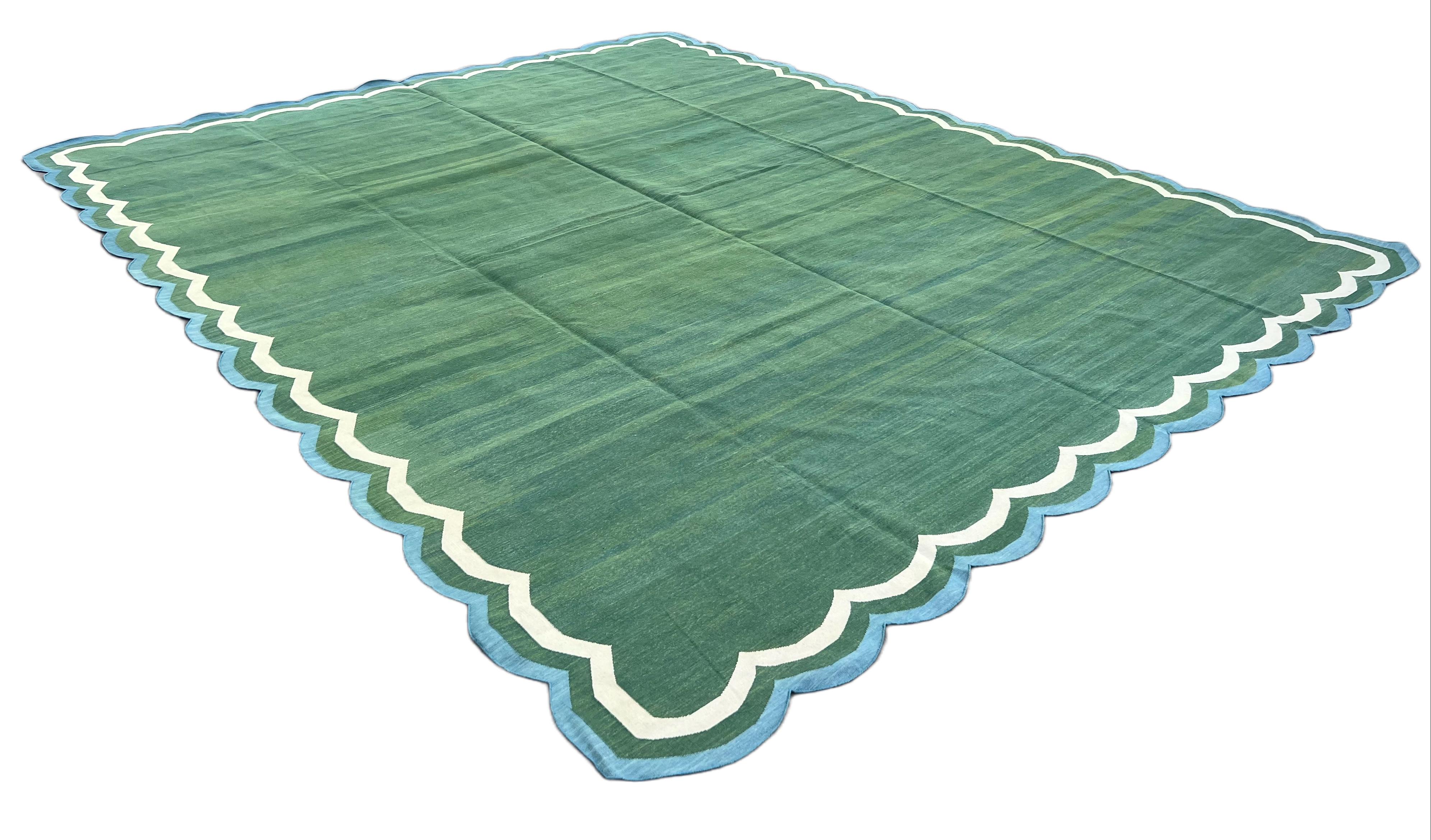 Cotton Vegetable Dyed Forest Green and Teal Blue 4 Sided Indian Scalloped Rug - 12'x15'
These special flat-weave dhurries are hand-woven with 15 ply 100% cotton yarn. Due to the special manufacturing techniques used to create our rugs, the size and