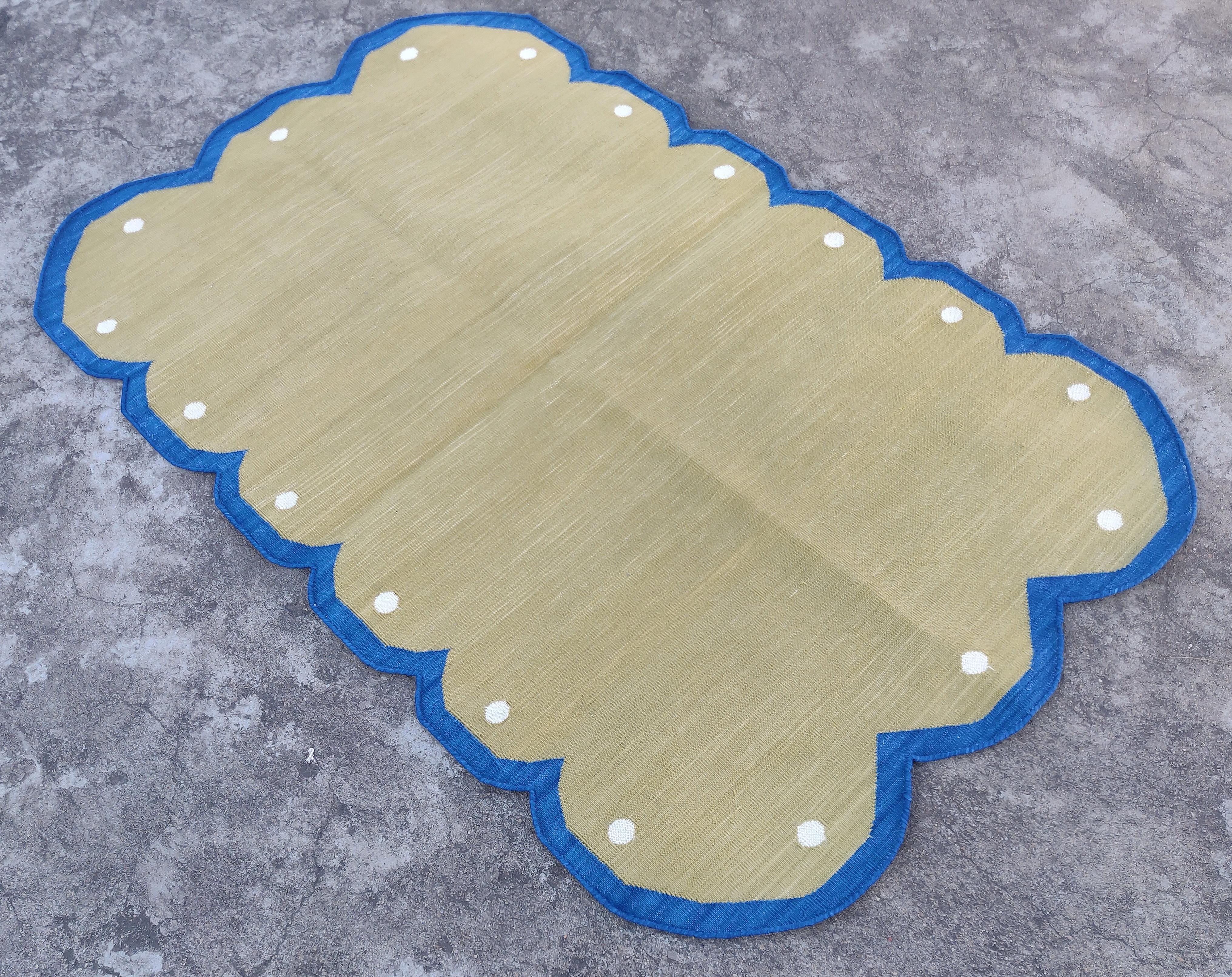 Cotton Vegetable Dyed Olive Green, Cream And Blue Scalloped Indian Dhurrie Rug-2.5'x4' (Scallops runs on all four sides)

These special flat-weave dhurries are hand-woven with 15 ply 100% cotton yarn. Due to the special manufacturing techniques used