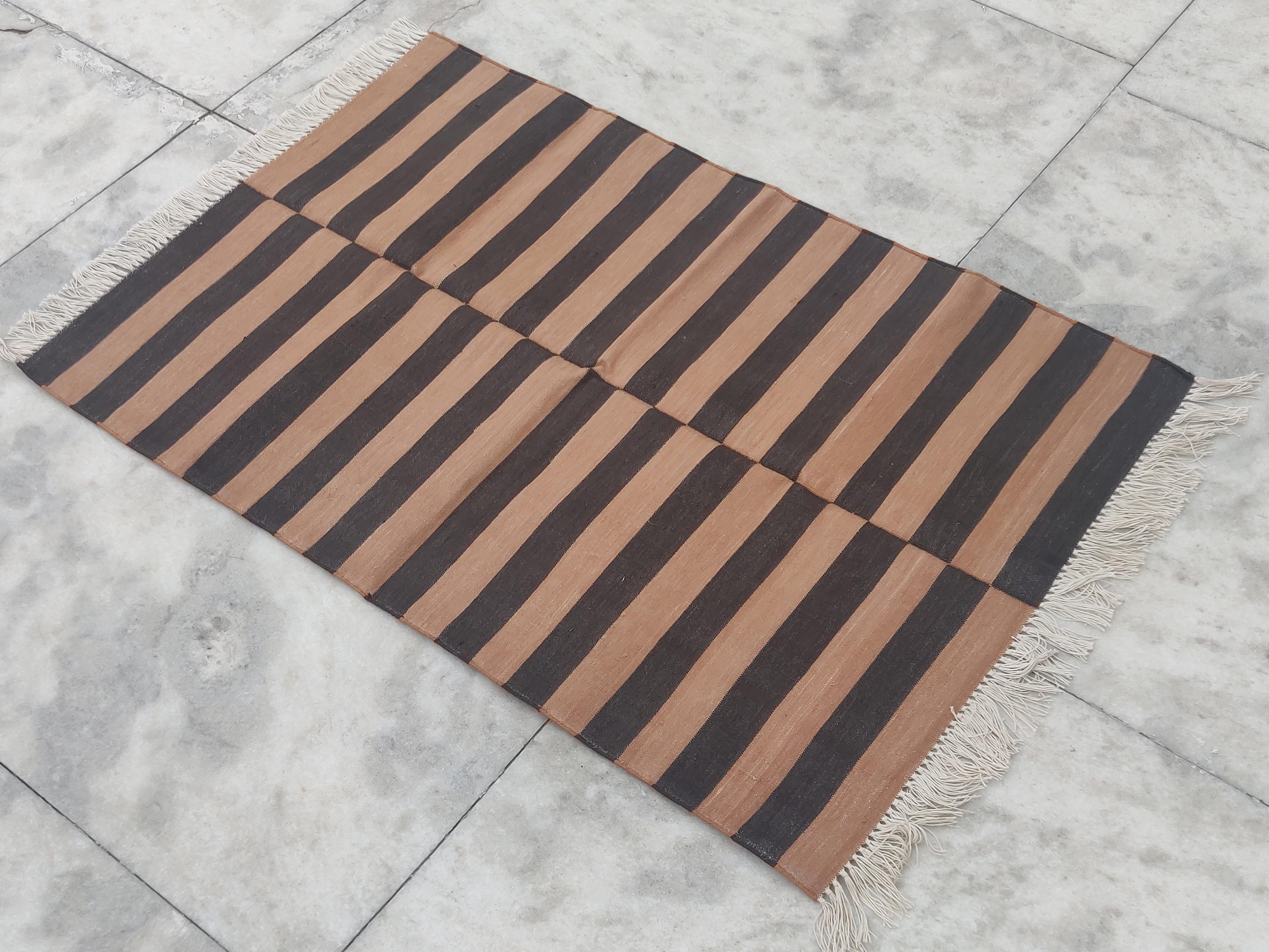 Cotton Vegetable Dyed  Tan And Brown Striped Indian Dhurrie Rug - 2.5'x4' (75x120cm) 

These special flat-weave dhurries are hand-woven with 15 ply 100% cotton yarn. Due to the special manufacturing techniques used to create our rugs, the size and