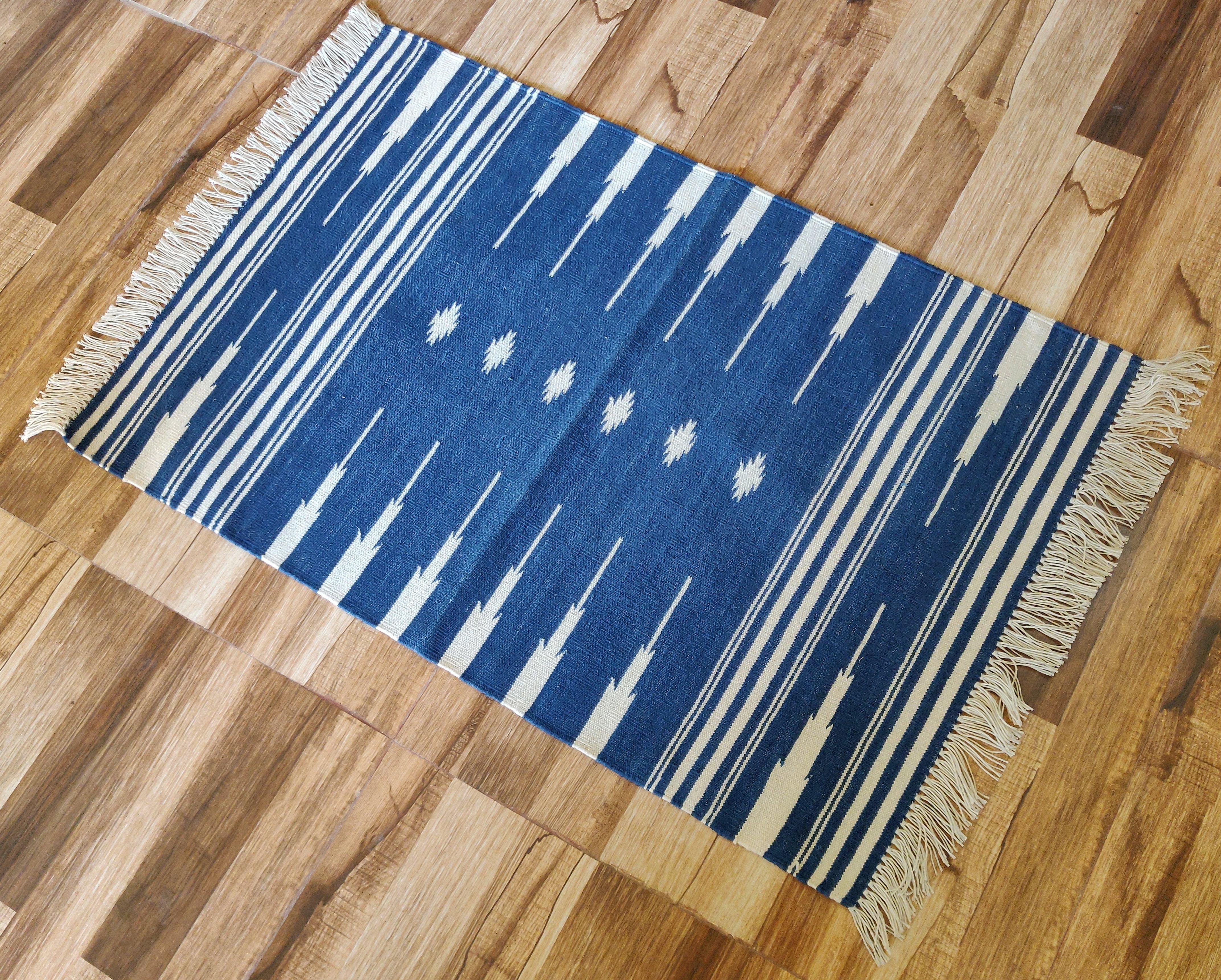 Cotton Vegetable Dyed  Blue And White Striped Indian Dhurrie Rug - 2'x3' (60x90cm) 

These special flat-weave dhurries are hand-woven with 15 ply 100% cotton yarn. Due to the special manufacturing techniques used to create our rugs, the size and
