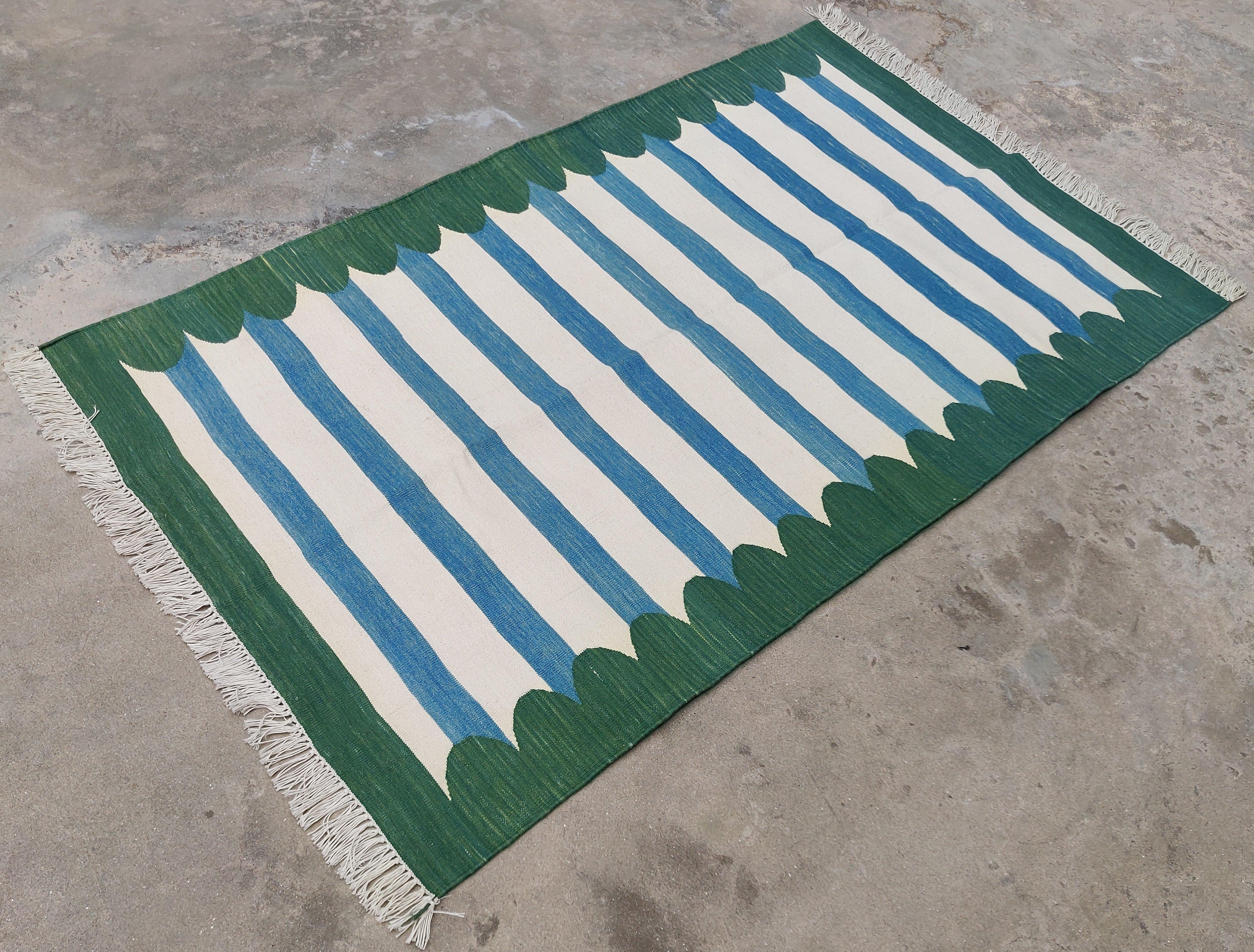 Cotton Vegetable Dyed Blue And Forest Green Scalloped Striped Indian Dhurrie Rug-3'x5' 
These special flat-weave dhurries are hand-woven with 15 ply 100% cotton yarn. Due to the special manufacturing techniques used to create our rugs, the size and