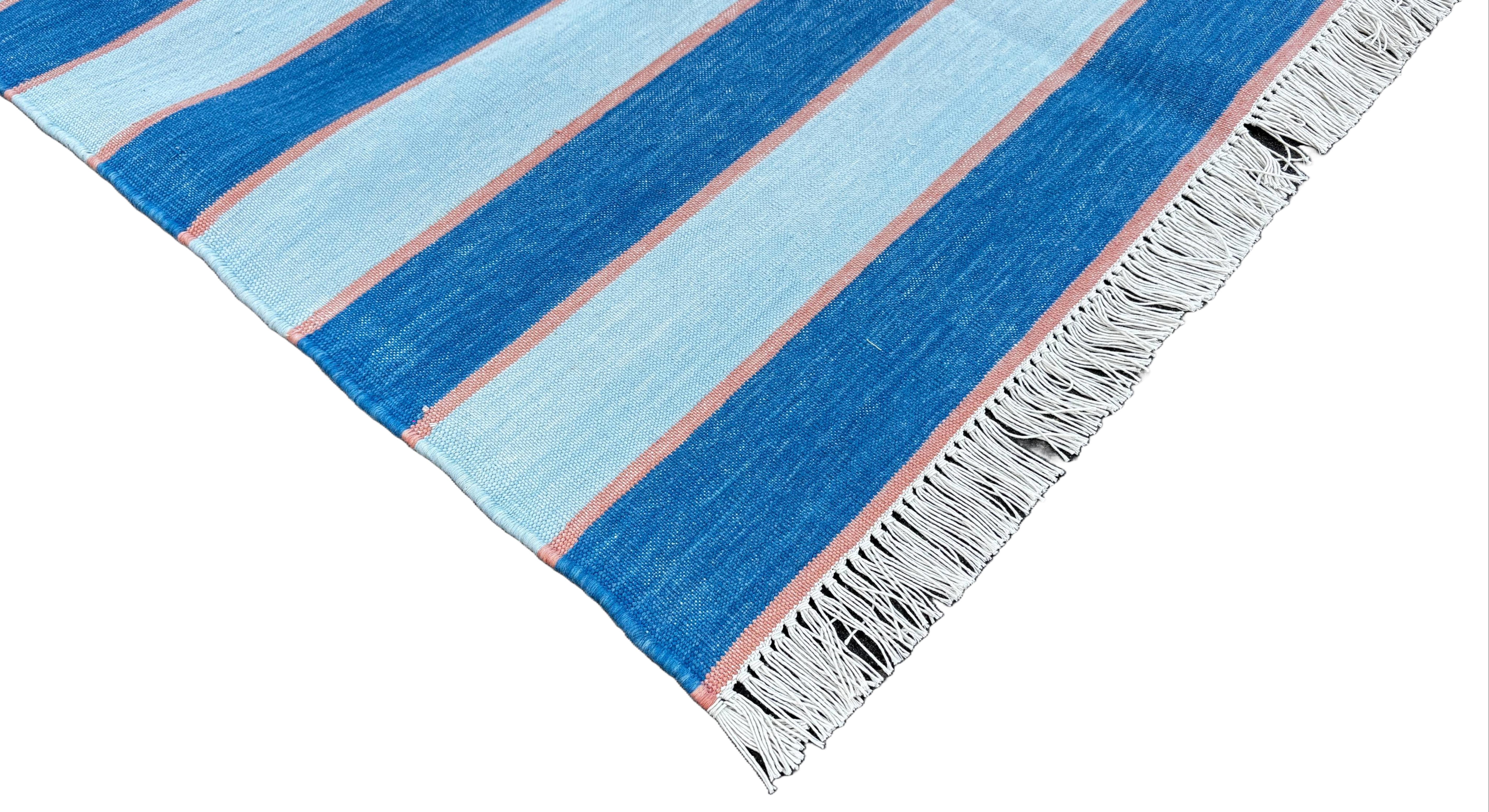 Cotton Vegetable Dyed Indigo Blue And Orange Striped Indian Dhurrie Rug-3'x5' (90x150cm)
 
These special flat-weave dhurries are hand-woven with 15 ply 100% cotton yarn. Due to the special manufacturing techniques used to create our rugs, the size