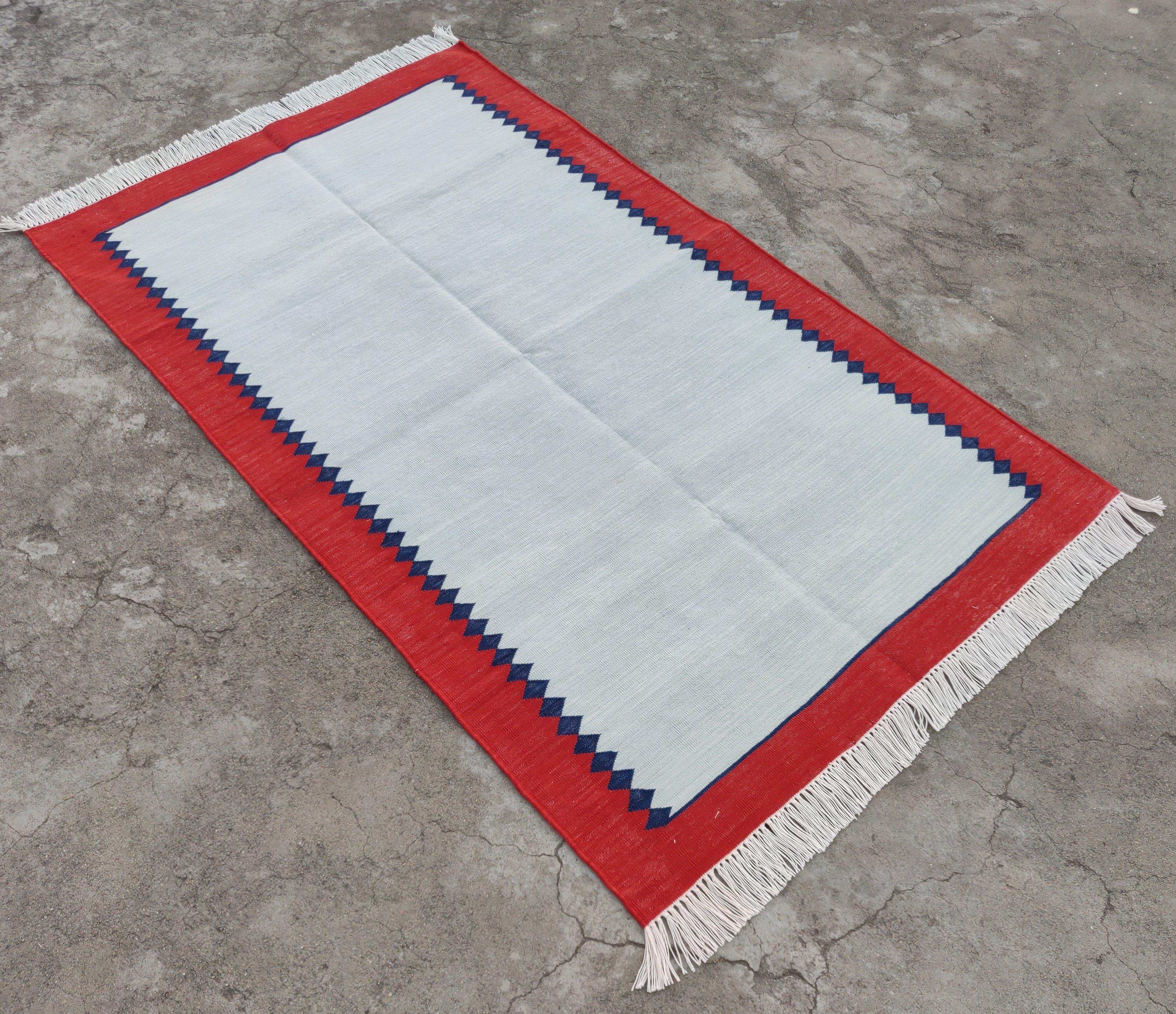 Cotton Vegetable Dyed Sky Blue And Red Zig Zag Striped Indian Dhurrie Rug-3'x5'

These special flat-weave dhurries are hand-woven with 15 ply 100% cotton yarn. Due to the special manufacturing techniques used to create our rugs, the size and color