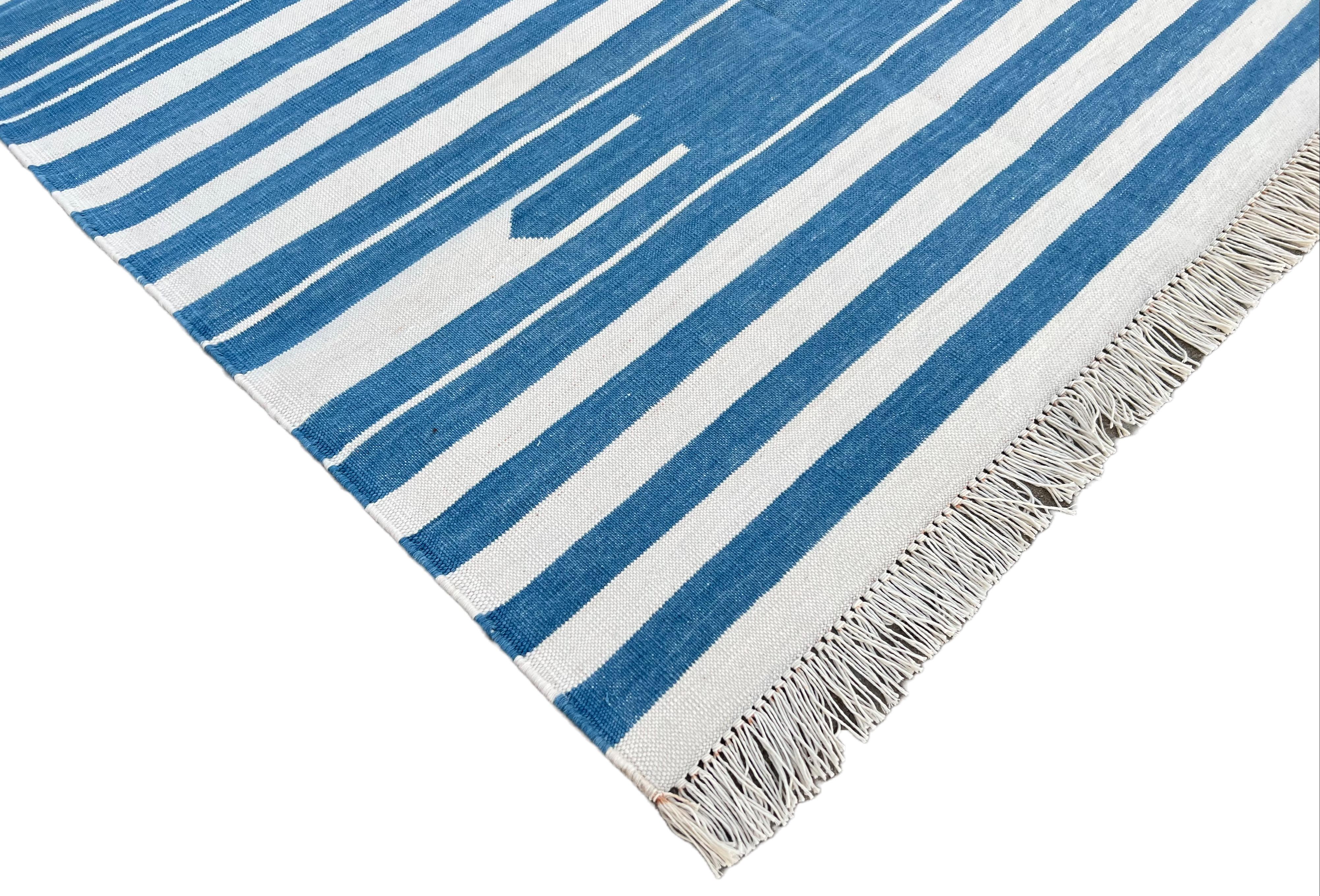 Cotton Vegetable Dyed Sky Blue And White Striped Indian Dhurrie Rug-3'x5'

These special flat-weave dhurries are hand-woven with 15 ply 100% cotton yarn. Due to the special manufacturing techniques used to create our rugs, the size and color of each