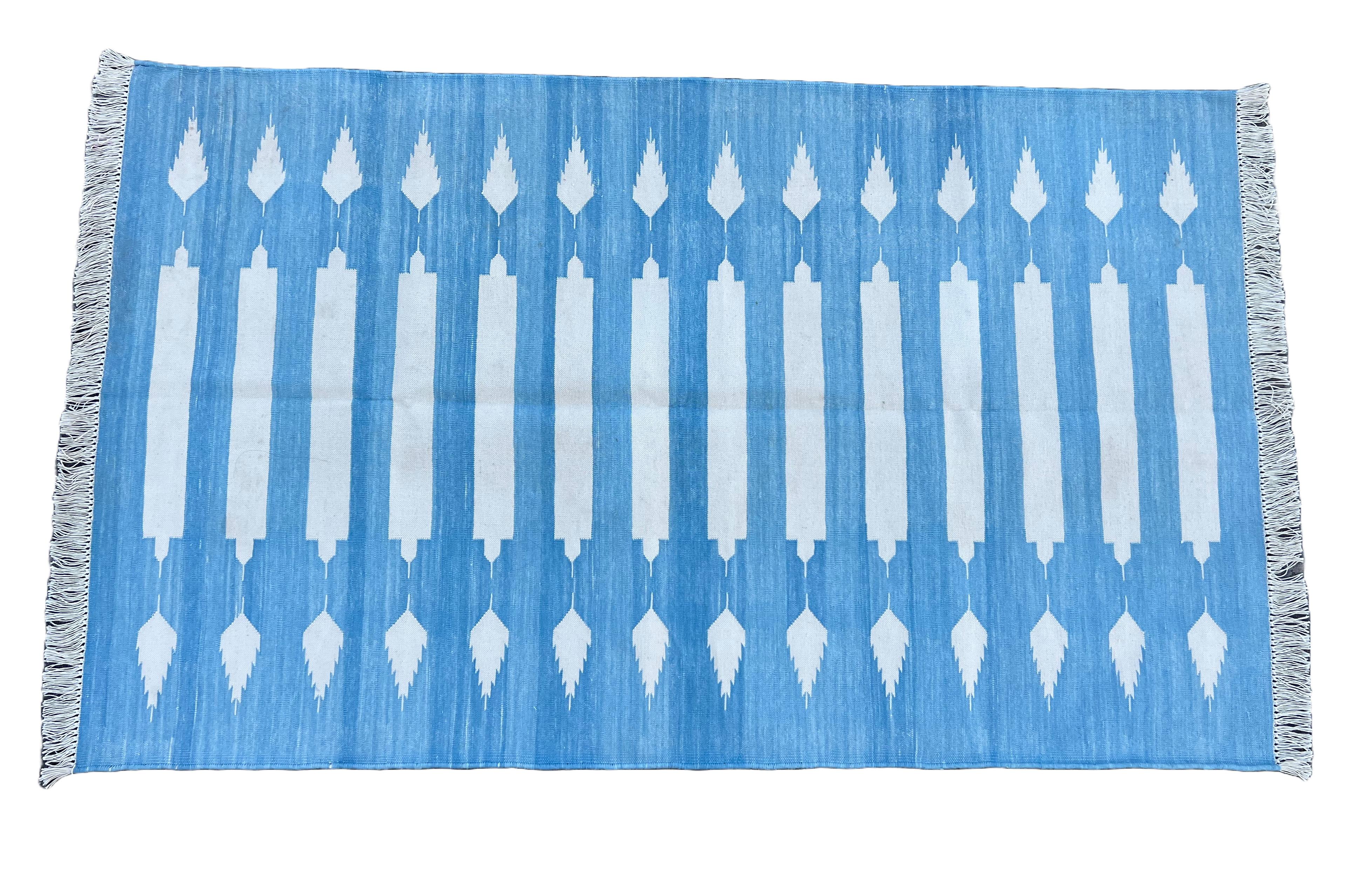 Cotton Vegetable Dyed Sky Blue And White Striped Indian Dhurrie Rug-3'x5' (90x150cm) 

These special flat-weave dhurries are hand-woven with 15 ply 100% cotton yarn. Due to the special manufacturing techniques used to create our rugs, the size and