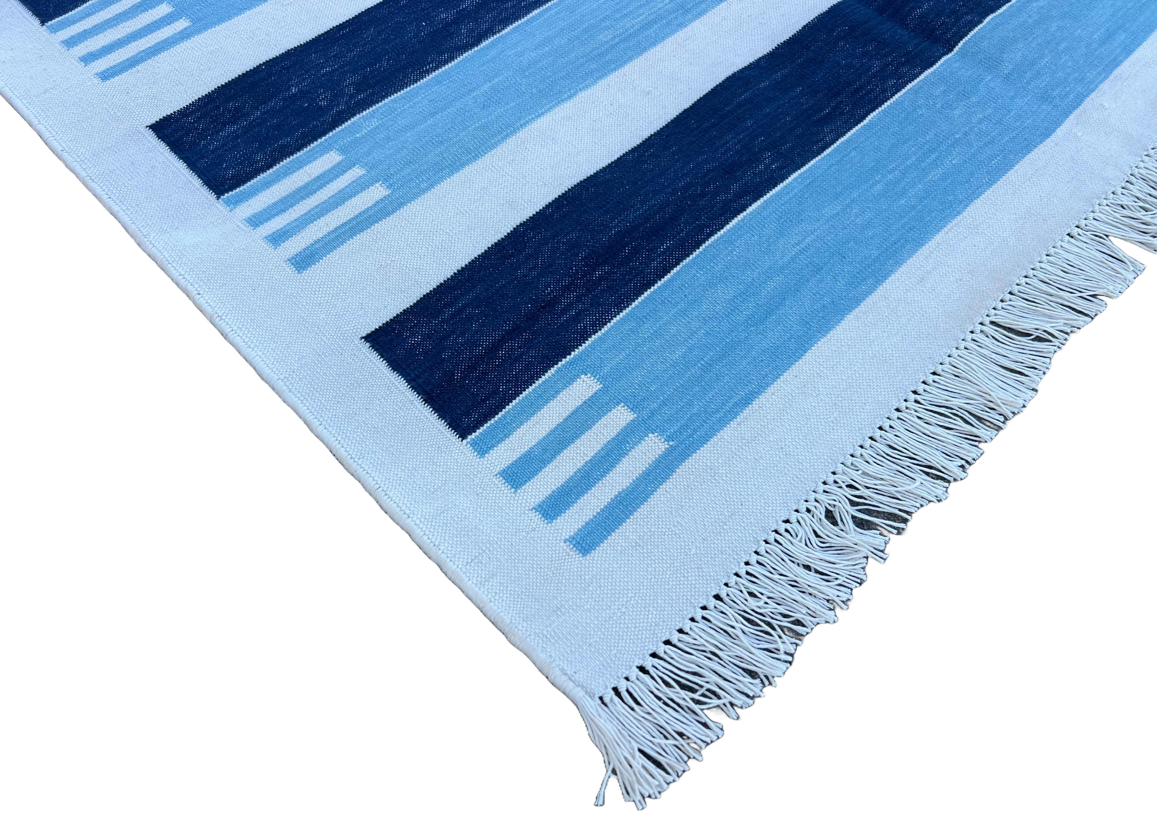 Cotton Vegetable Dyed Sky Blue And White Striped Indian Dhurrie Rug-3'x5' (90x150cm) 

These special flat-weave dhurries are hand-woven with 15 ply 100% cotton yarn. Due to the special manufacturing techniques used to create our rugs, the size and